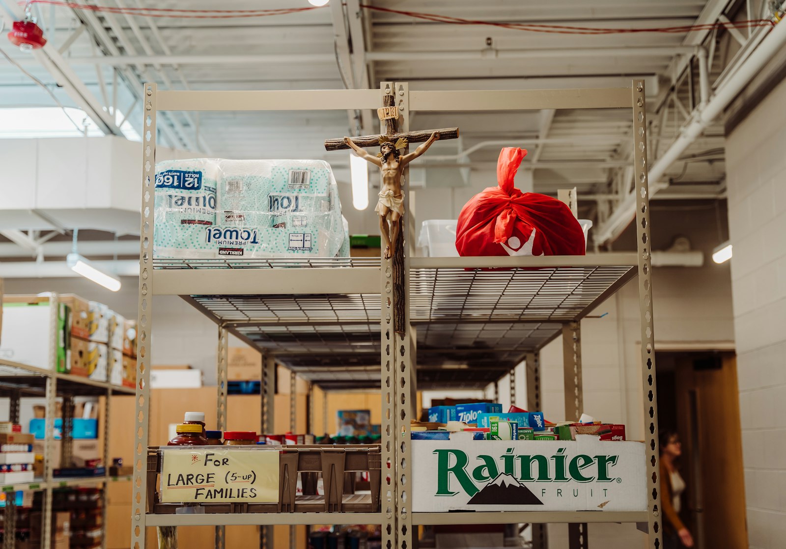 A crucifix is seen inside the food pantry at St. Paul of Tarsus Parish in Clinton Township. Across the Archdiocese of Detroit, directors of evangelical charity will be tasked with imbuing Christian service efforts with the Gospel, ensuring parishes' outreach efforts align with a spirit of missionary evangelization, leaders say.