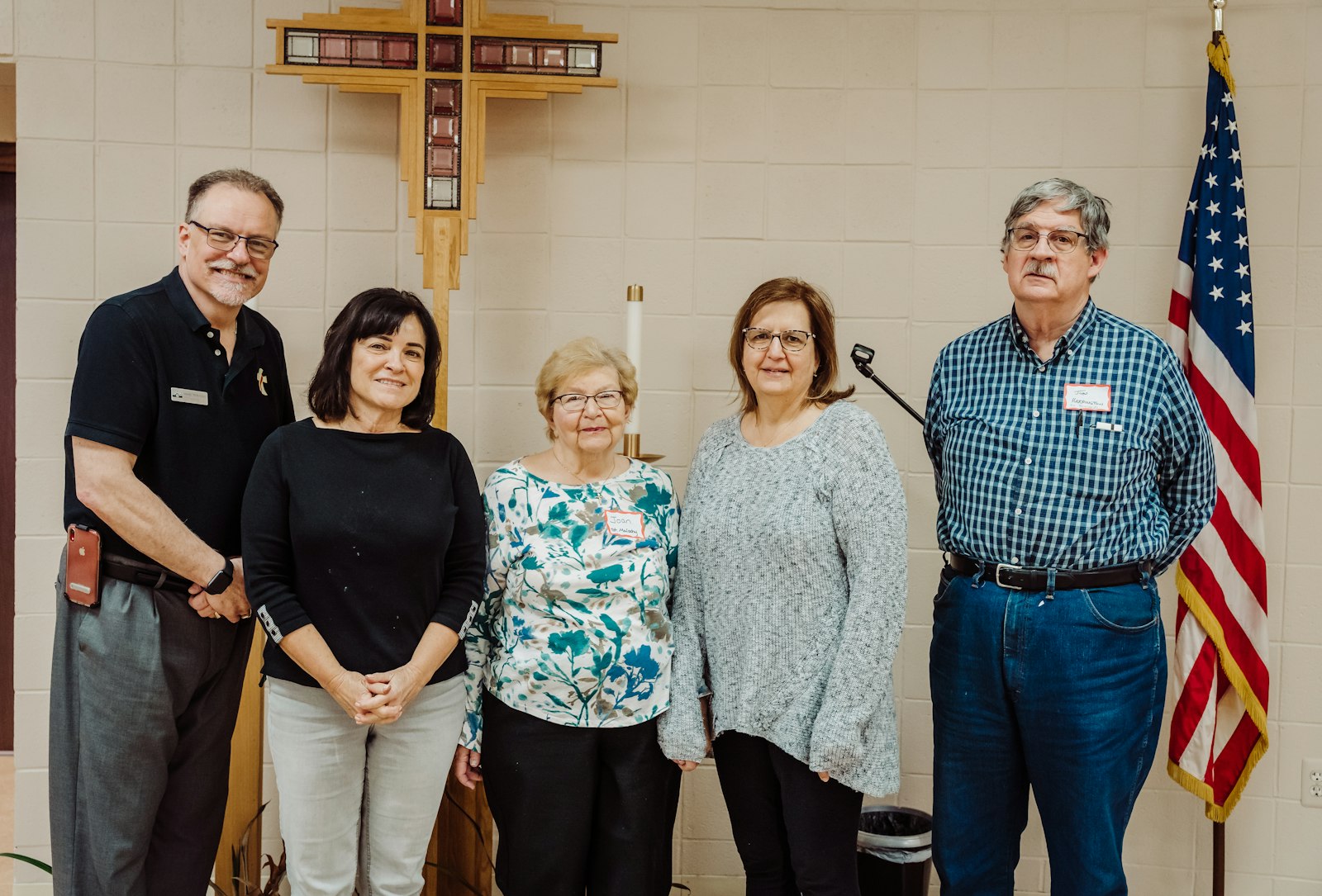 Left to right, Deacon Marc Rybinski (St. Paul of Tarsus), Cheryl Cannon (from St. Thecla), Joan Jeffers (St. Malachy), Carol Challis (St. Malachy) and John Harrington (St. Ronald) pose for a photo after a meeting of Christian service leaders for the four parishes, which together make up Central Macomb Family 5.