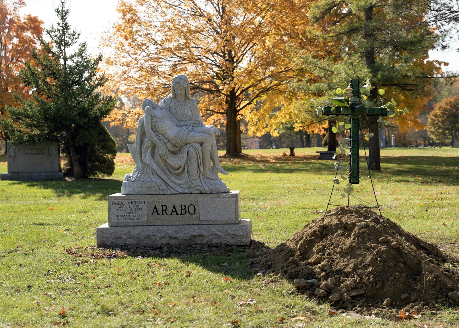 Headstones and memorial markers tell a story about the deceased's life, often through their faith told with depictions of angels, saints, Jesus and Mary, as well as Scripture verses.