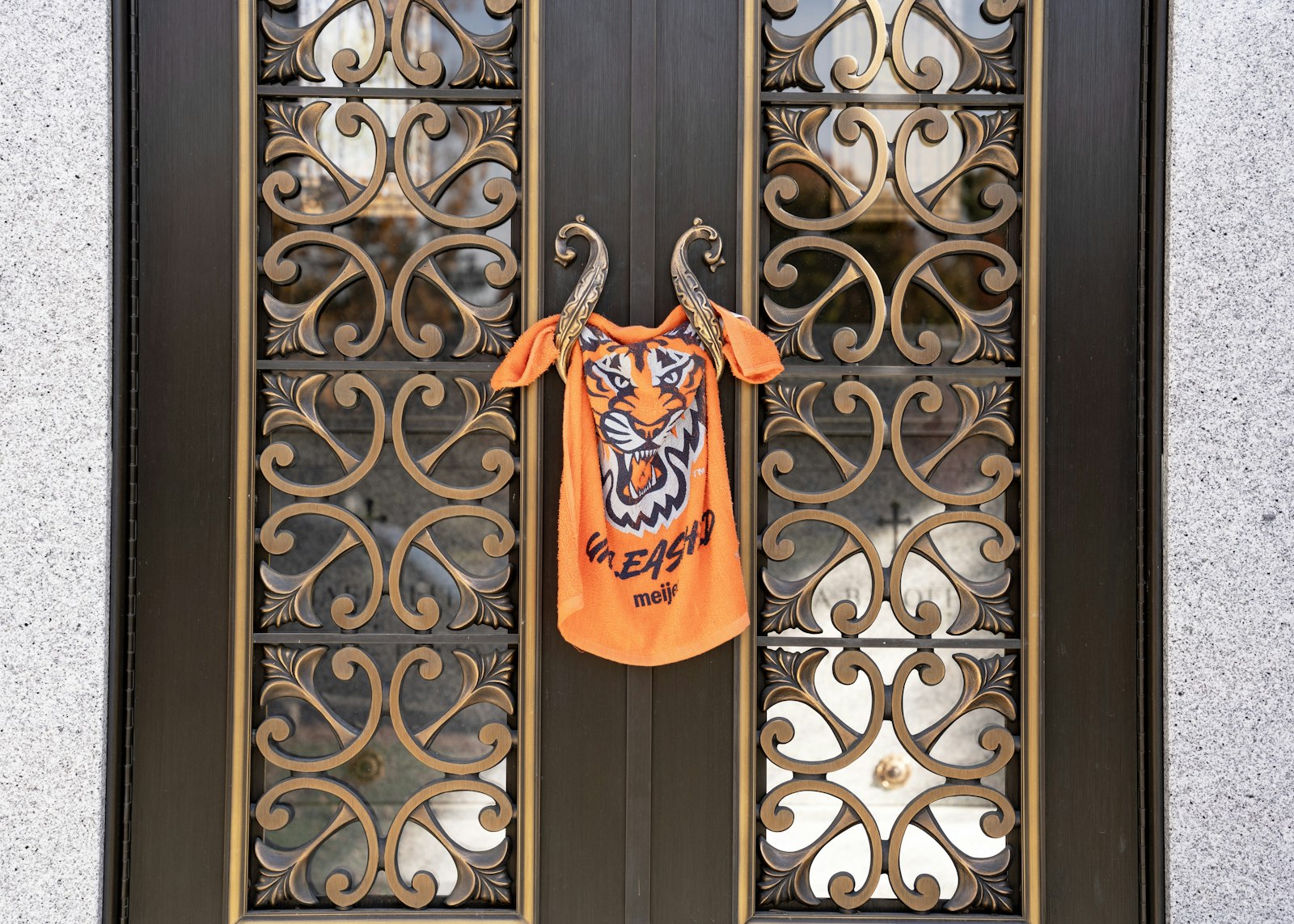 A Detroit Tigers t-shirt hangs on the door of the mausoleum.