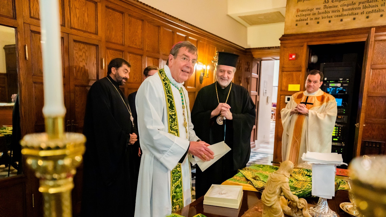Archbishop Vigneron smiles during a reception with Greek Orthodox Metropolitan Nicholas in the sacristy of the Cathedral of the Most Blessed Sacrament during a celebration for his 25th episcopal jubilee on July 11, 2021. (Valaurian Waller | Detroit Catholic)