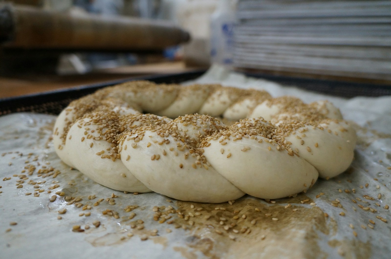 Made from semolina flour, the tradition is for simple round loaves, topped with sesame seeds or a cross indentation, or more complicated hand-braided loaves in shapes usually in the form of crowns, St. Joseph staffs, or crosses.