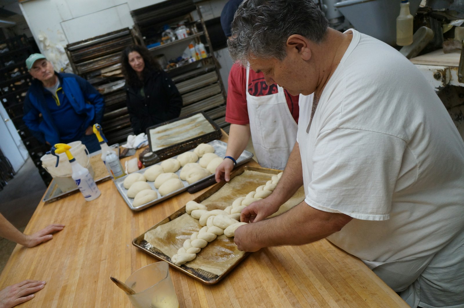 Sam Zerilli, owner of Zerilli Bakery in Clinton Township, folds dough into the shape of a cross March 19 in preparation for St. Joseph's feast day.