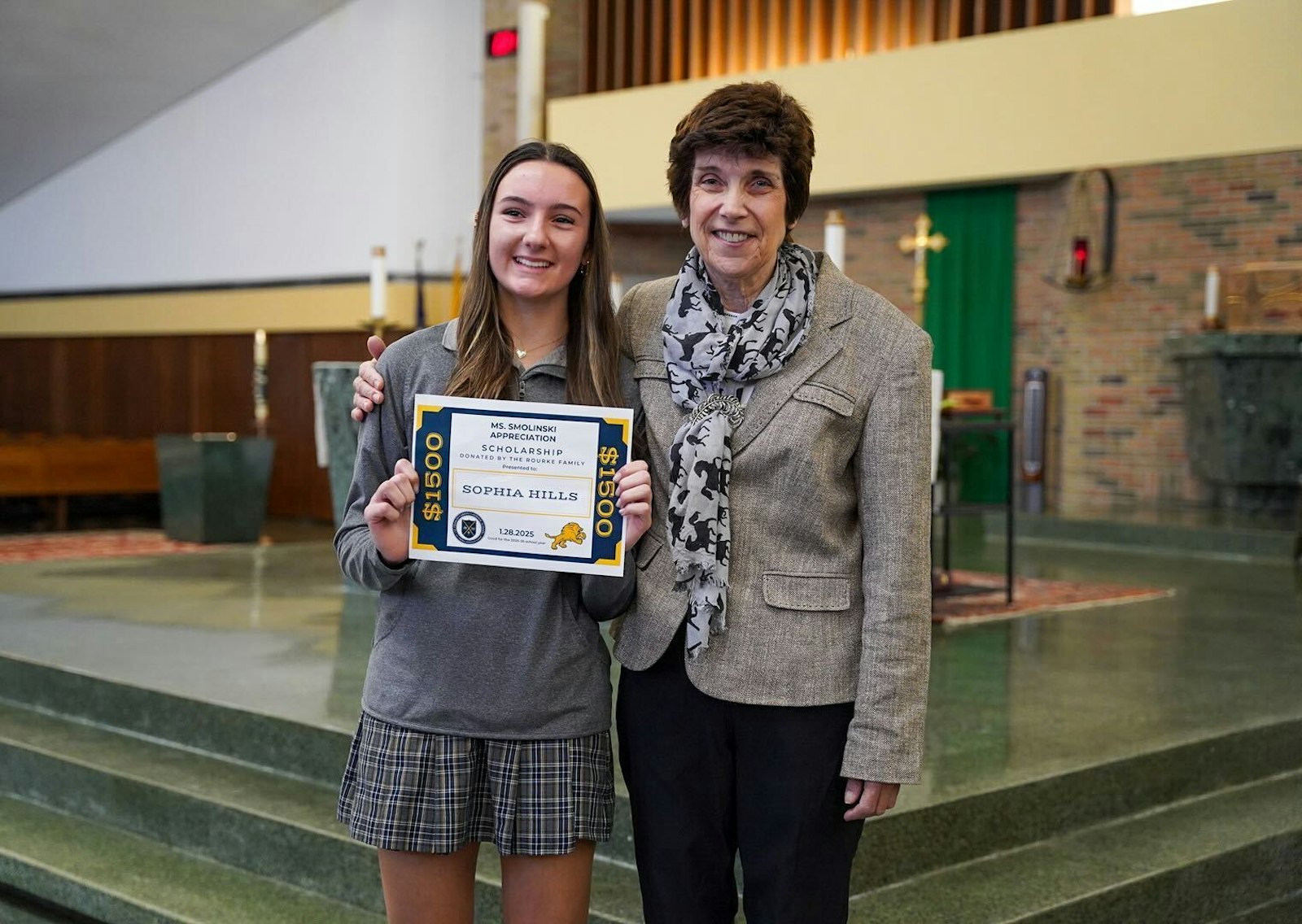 Sophia Hills, an eighth-grader at Cabrini Academy, was awarded a scholarship to Cabrini High School for next year after submitting a video on her appreciation for Smolinski as a teacher. A montage of videos from Cabrini students past and present was played following an all-school Mass.