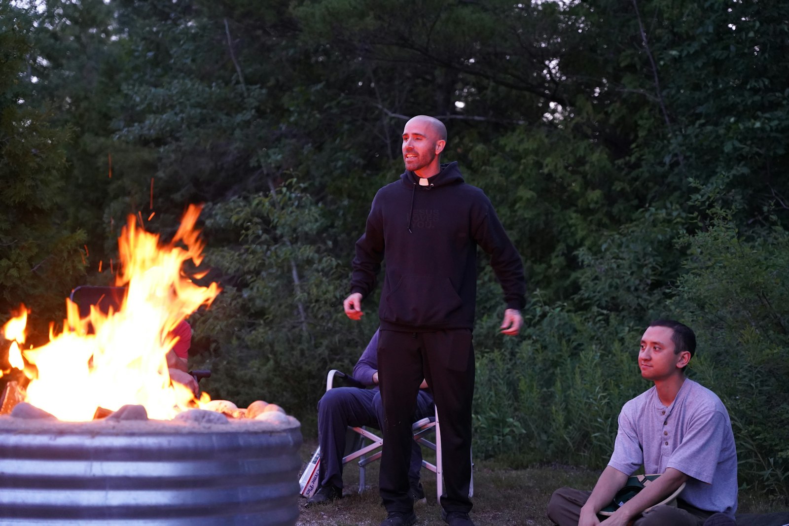 Fr. Adam Maher delivers a sermon by the bonfire on the first night of the retreat. Fr. Maher emphasized the hiking pilgrimage was not a vacation, and challenged the retreatants to discern what it is God was telling them during the weekend.