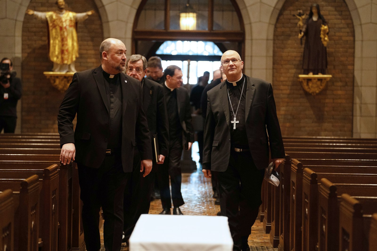 Fr. Stephen Burr, left, rector of Sacred Heart Major Seminary, leads Archbishop-elect Weisenburger into Sacred Heart's chapel for the first time early Feb. 11.