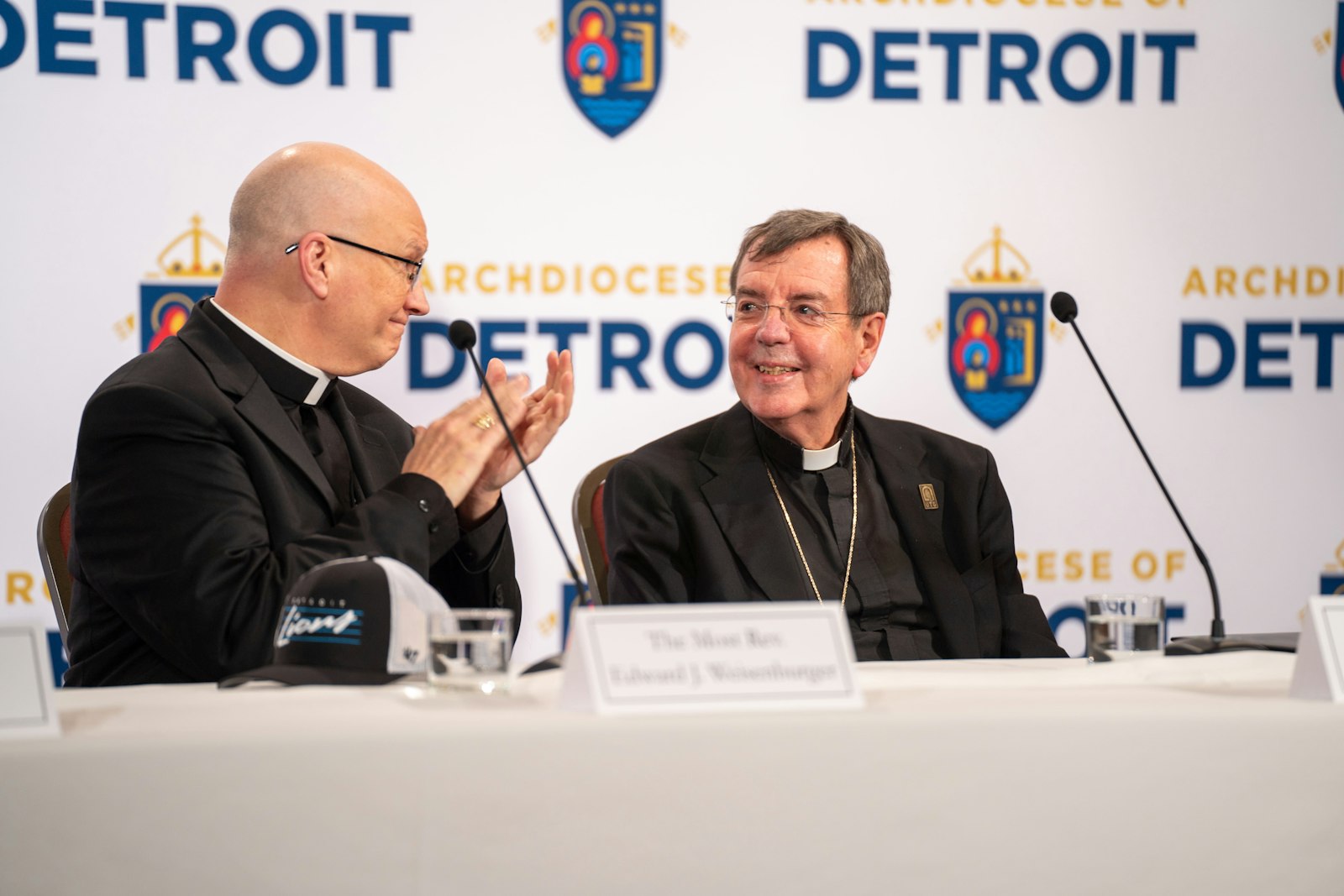 Archbishop-elect Weisenburger leads applause for retiring Detroit Archbishop Allen H. Vigneron, whose leadership of the Archdiocese of Detroit since 2009 has brought many blessings to the local Church, the new archbishop-elect said. Archbishop-elect Weisenburger will become Detroit's sixth archbishop during an installation Mass on March 18 at the Cathedral of the Most Blessed Sacrament.