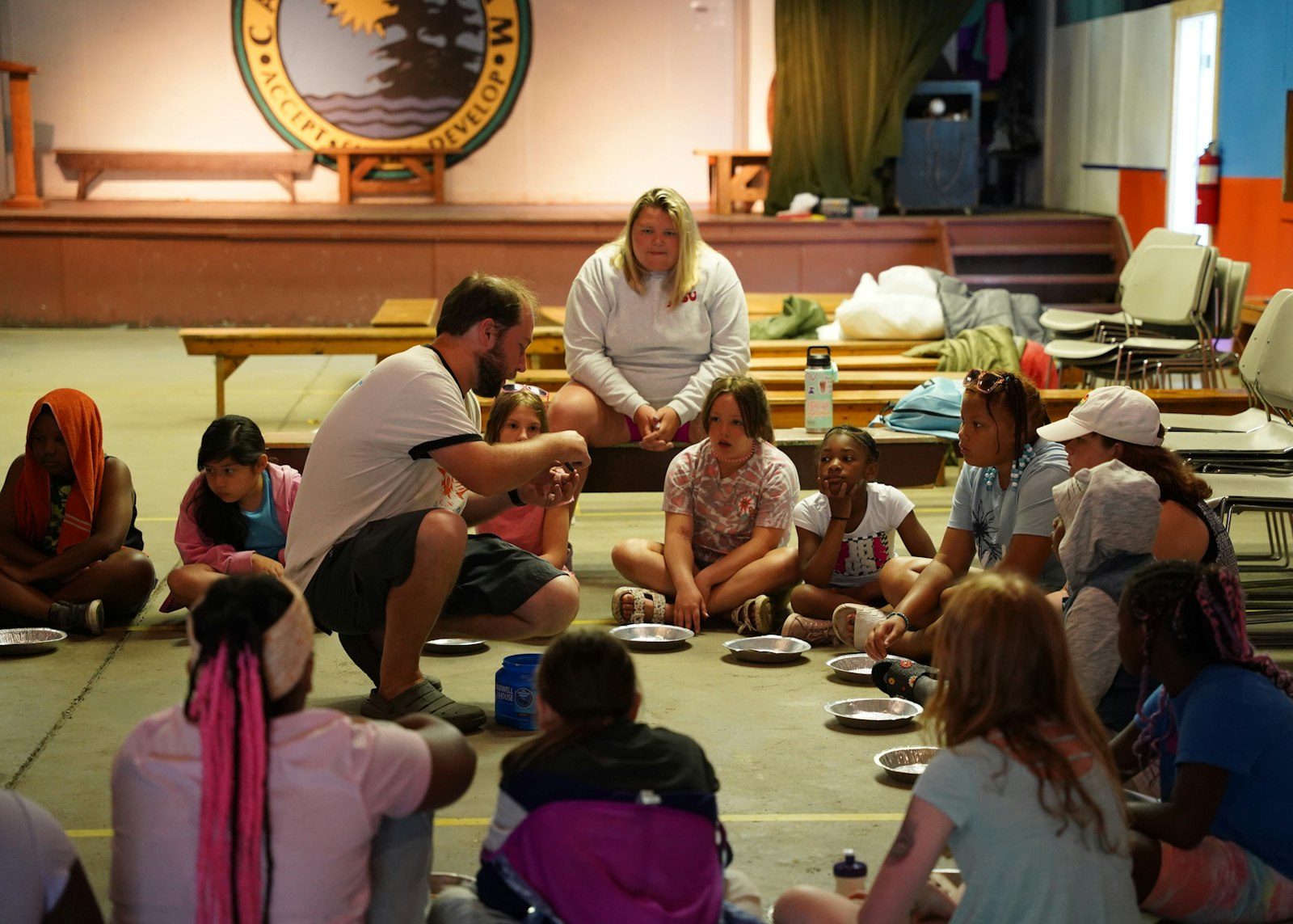 Counselors go over different types of rocks with campers after a geology lesson at Camp Ozanam. Many of the counselors are former campers themselves, who return to the camp because of the profound impact it made on their own lives.