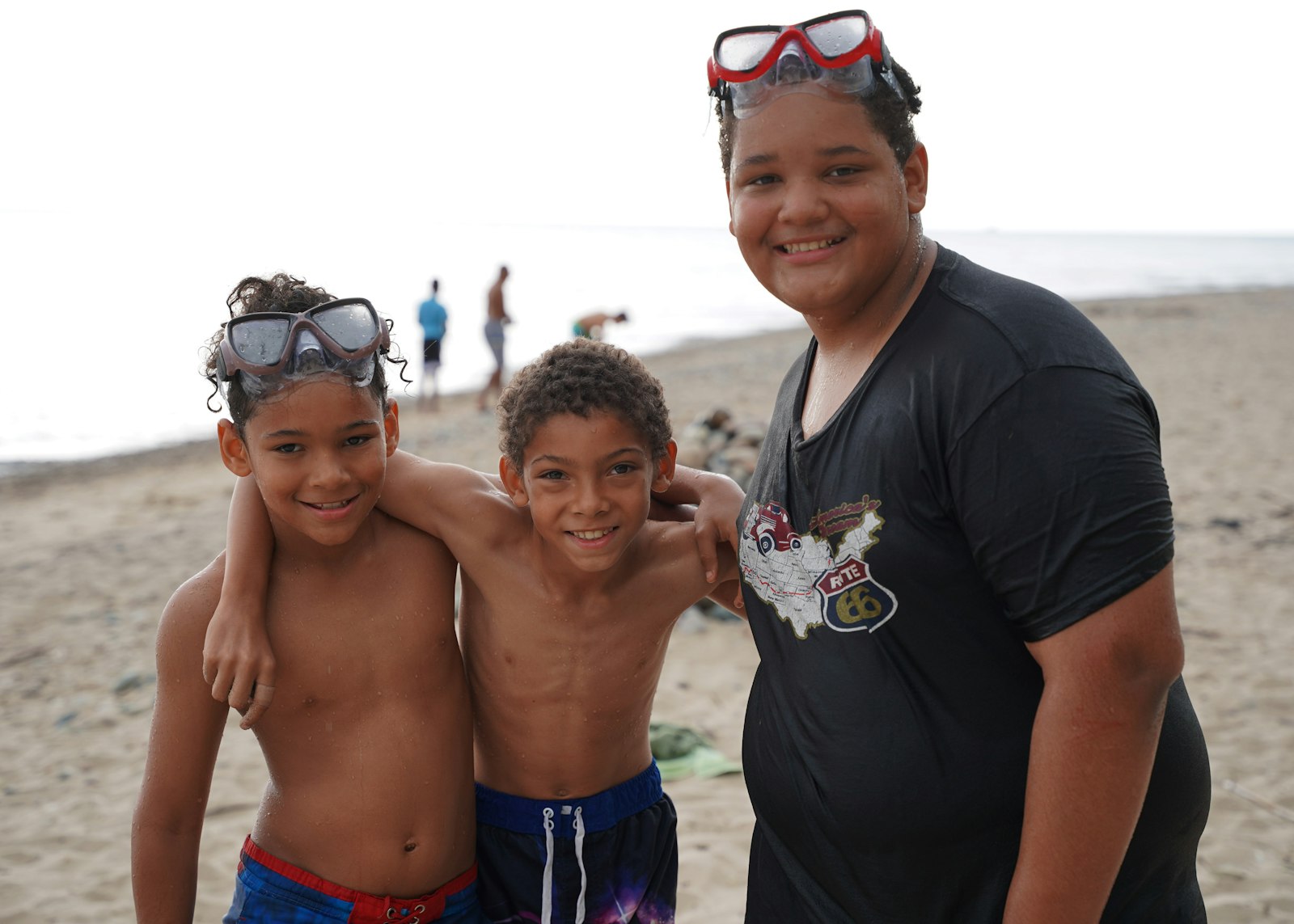 Siblings enjoy a day at the beach, their second week of the summer spent at Camp Ozanam. The youths said they have attended Camp Ozanam in past years and look forward to the excursion each summer.