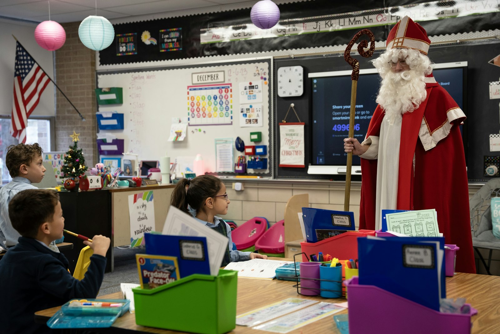 St. Nicholas, played by St. Mary's parent volunteer Matt Taszreak, visits children at the Royal Oak school Dec. 6. The feast of St. Nicholas, or “St. Nicholas Day,” is a long-standing Catholic tradition at the beginning of Advent, dating back to the 1200s in France. The beloved bishop was known for his good deeds, particularly to the needy and children. He gave gifts generously and often anonymously.