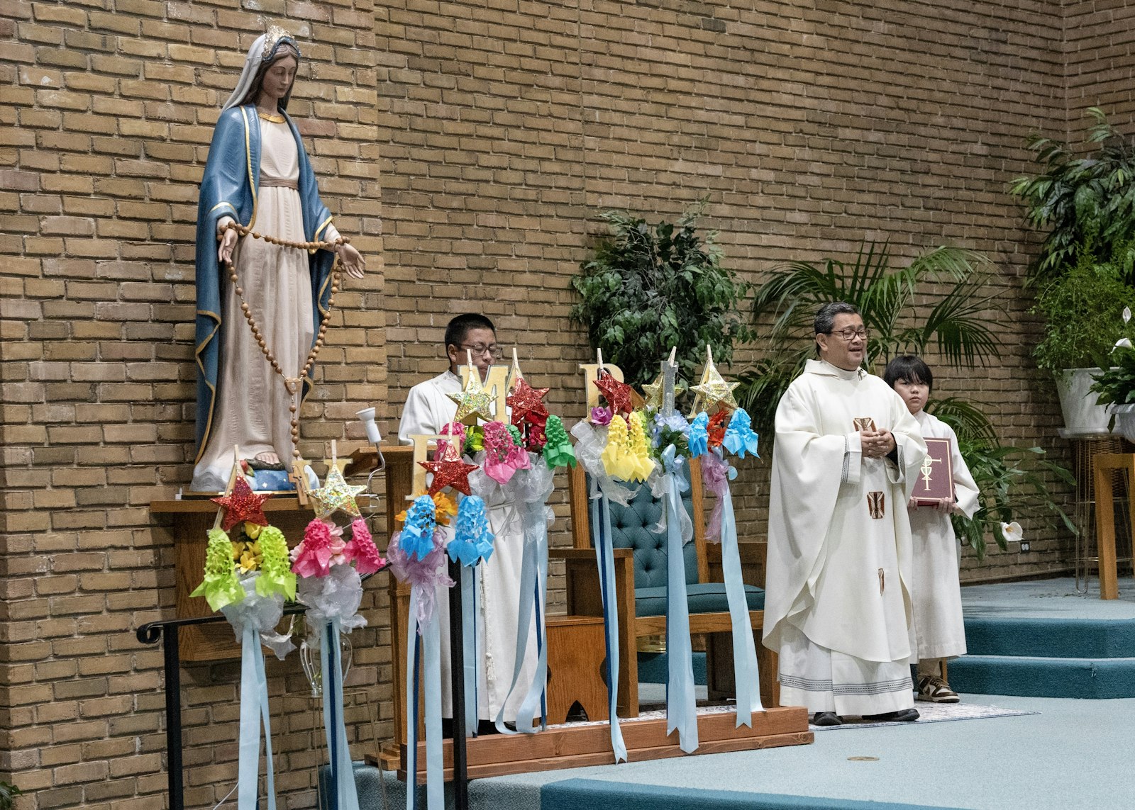 "I invite all of us to receive Christ tonight with the attitude of our mother, our gentle lady. She is always the image, the model for all of us for what it means to receive Christ," Fr. Dango said.