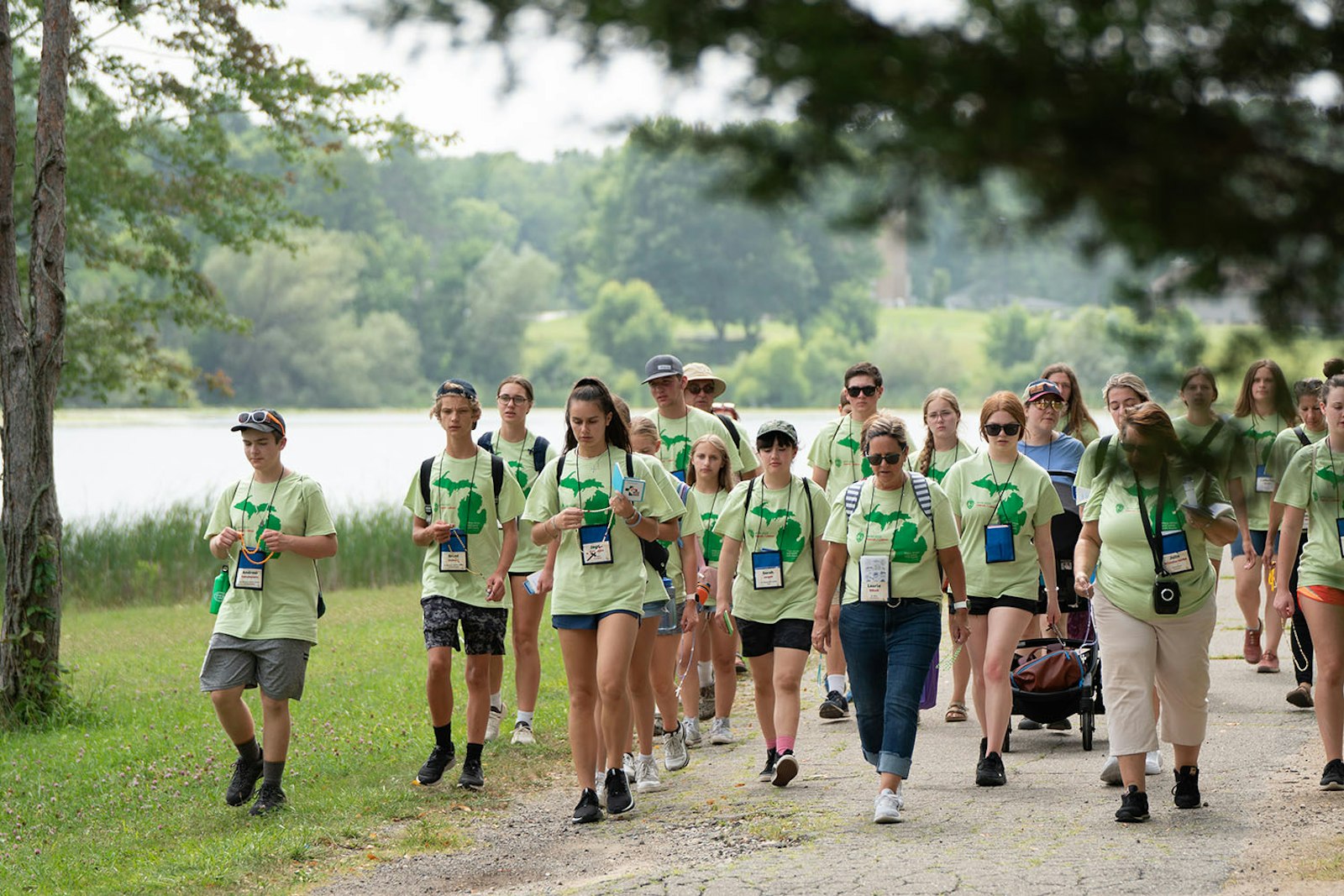 More than 60 young people take part in a walking rosary pilgrimage around the lake at Our Lady of the Fields Camp in Brighton during a World Youth Day "Home" event Aug. 5.