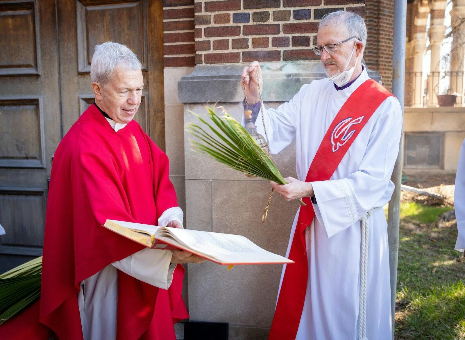 Msgr. Daniel Trapp presides over a Palm Sunday liturgy at St. Augustine and St. Monica Parish on Detroit's east side in 2022. (Valaurian Waller | Detroit Catholic)