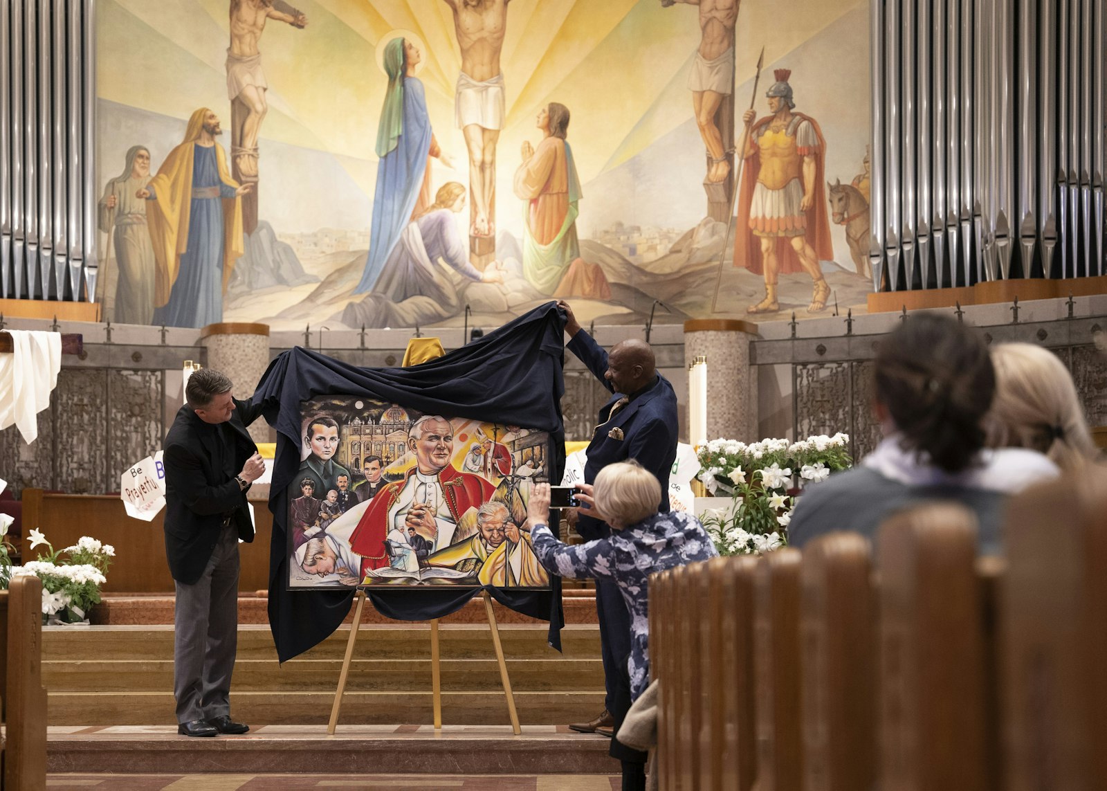 Fr. Andrew Kowalczyk, CSMA, and Lewis unveiled the painting for students following all-school morning Mass on April 27.