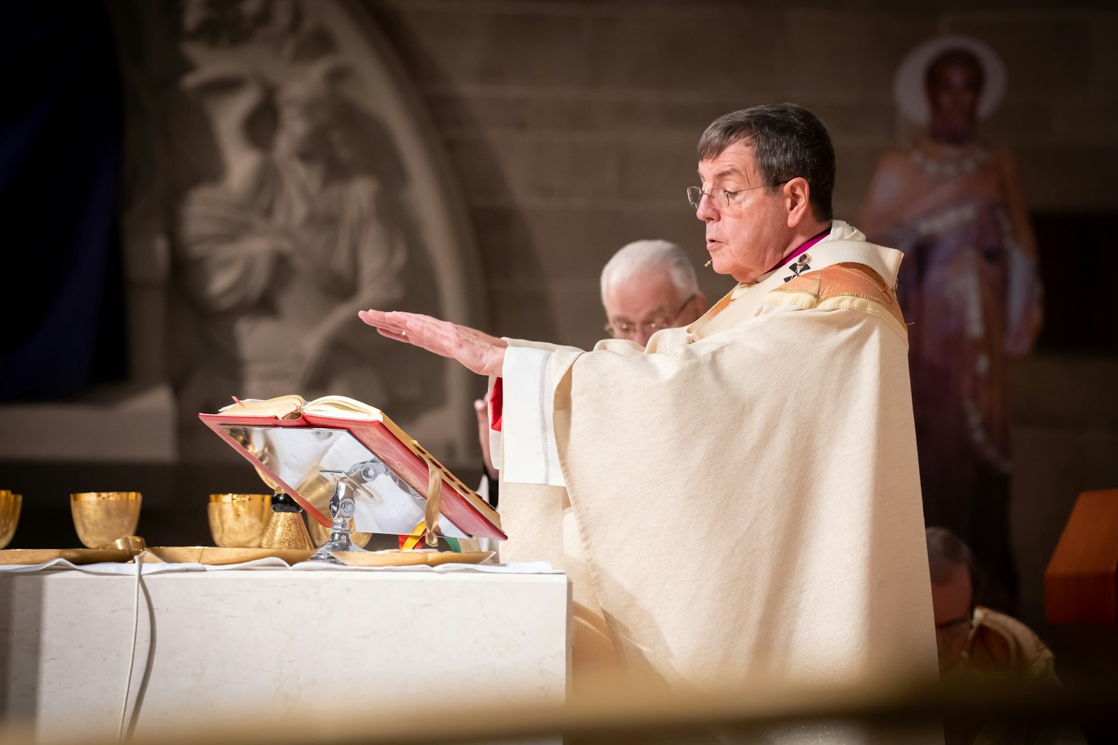 Archbishop Allen H. Vigneron consecrates the Eucharist during the Chrism Mass on Holy Thursday, April 14, at the Cathedral of the Most Blessed Sacrament. Tomorrow, the archbishop will preside over a special Holy Hour to pray for priestly vocations at the cathedral. (Valaurian Waller | Detroit Catholic)