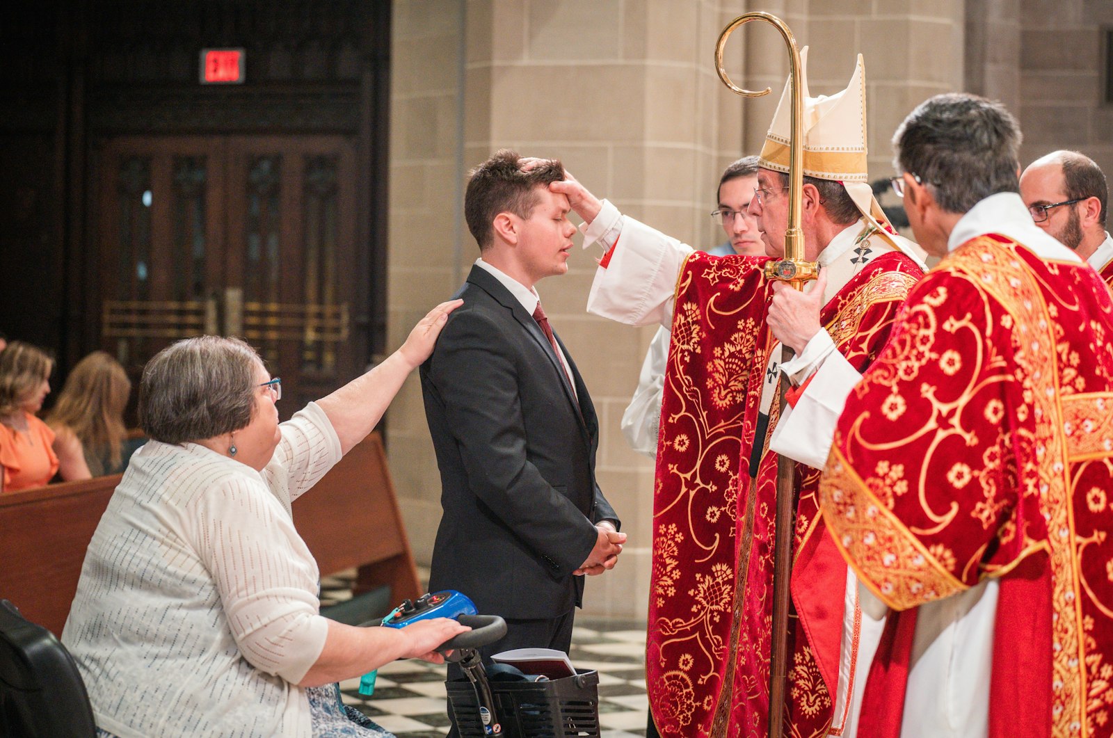 Archbishop Vigneron confirms a young man during a Pentecost Sunday Mass at the Cathedral of the Most Blessed Sacrament. The archbishop asked for prayers from the faithful as the archdiocese seeks to continue to obediently carry out this mission, particularly for the Missionary Renewal Assembly, which will take place at the end of June.