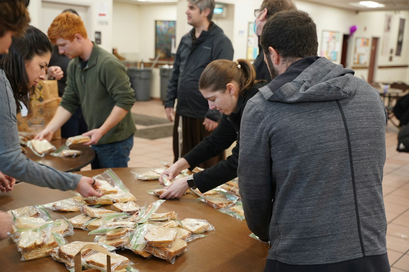 Around 30 young adults made sandwiches and delivered them to the Capuchin Soup Kitchen's Connor location as part of Simple Service Saturday, a staple of the Solanus Casey YouFra chapter.