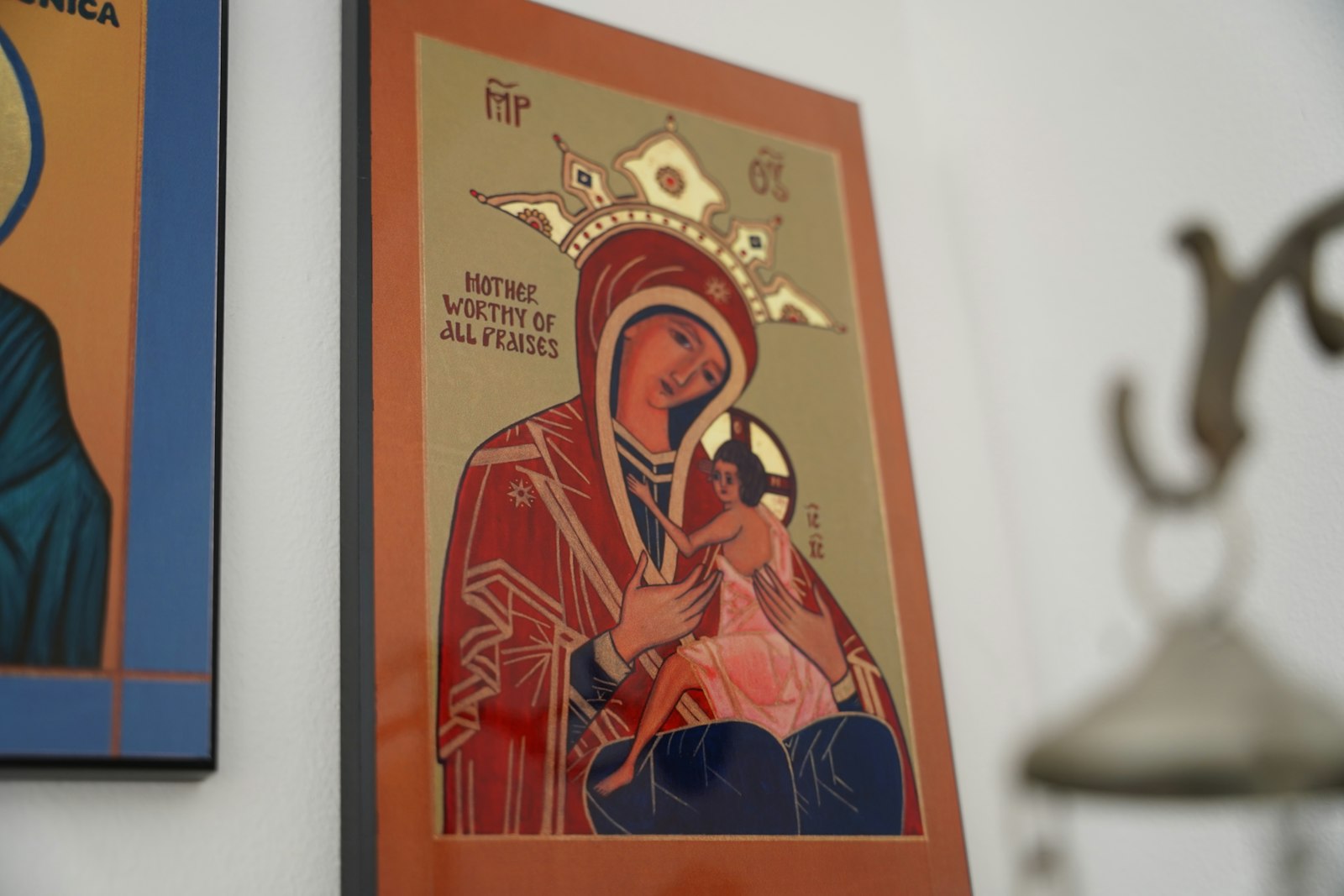 An icon of Mary, Mother Worthy of All Praises. Crombie explains in iconography, Mary is depicted with three stars, one on her head and one on each shoulder, signifying her virginity before, during and after the birth of Christ.