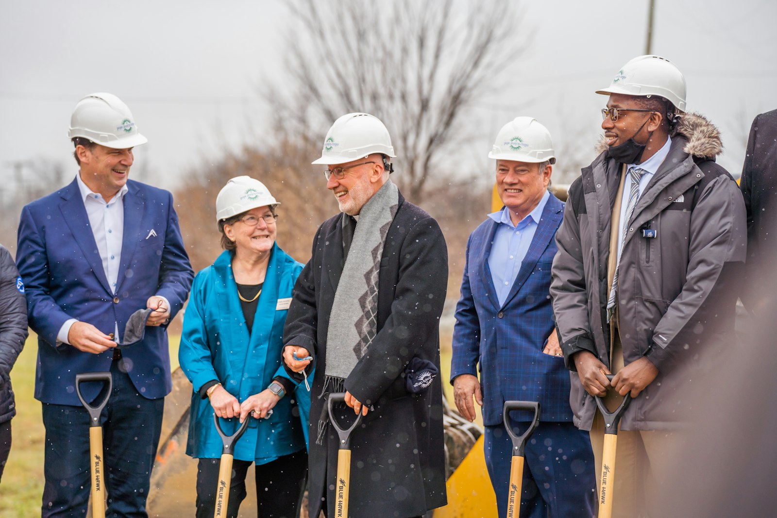 Left to right, Jim Farley, CEO of Ford Motor Company; Robbie Murphy, a board member at the Julie Burke Foundation; Fr. Tim McCabe, SJ, director of the Pope Francis Center; Detroit Mayor Mike Duggan; and Donald Rencher, group executive for the city's Department of Planning, Housing and Development, break ground Dec. 3 at the site of a new bridge housing facility for the Pope Francis Center on Detroit's west side. (Valaurian Waller | Detroit Catholic)