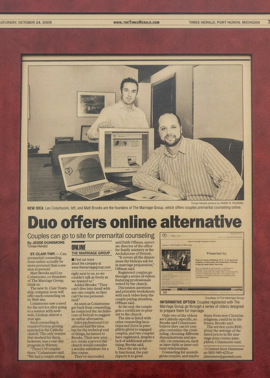 Newspaper clippings from the Port Huron Times Herald hang on the walls highlighting The Marriage Group's beginnings in 2009.
