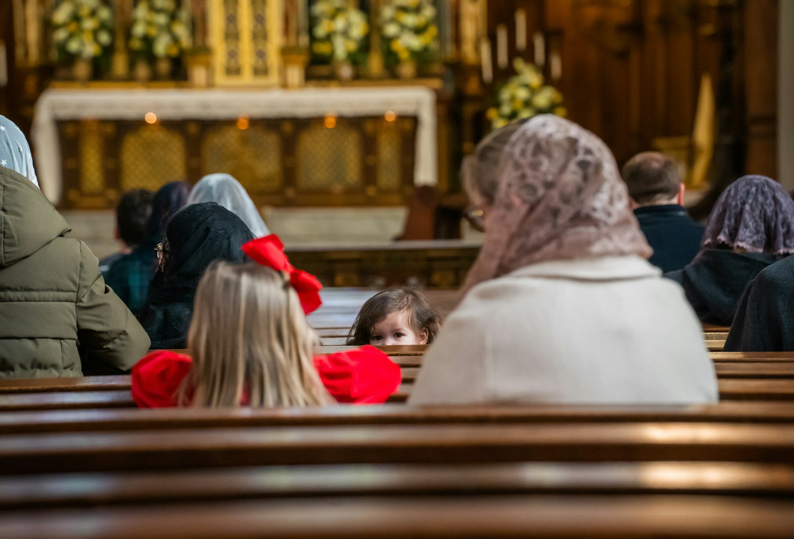 While the littlest ones may be too young to fully comprehend the Eucharist, children receive grace from God simply by being in His presence, Fr. Cybulski said. (Valaurian Waller | Detroit Catholic)