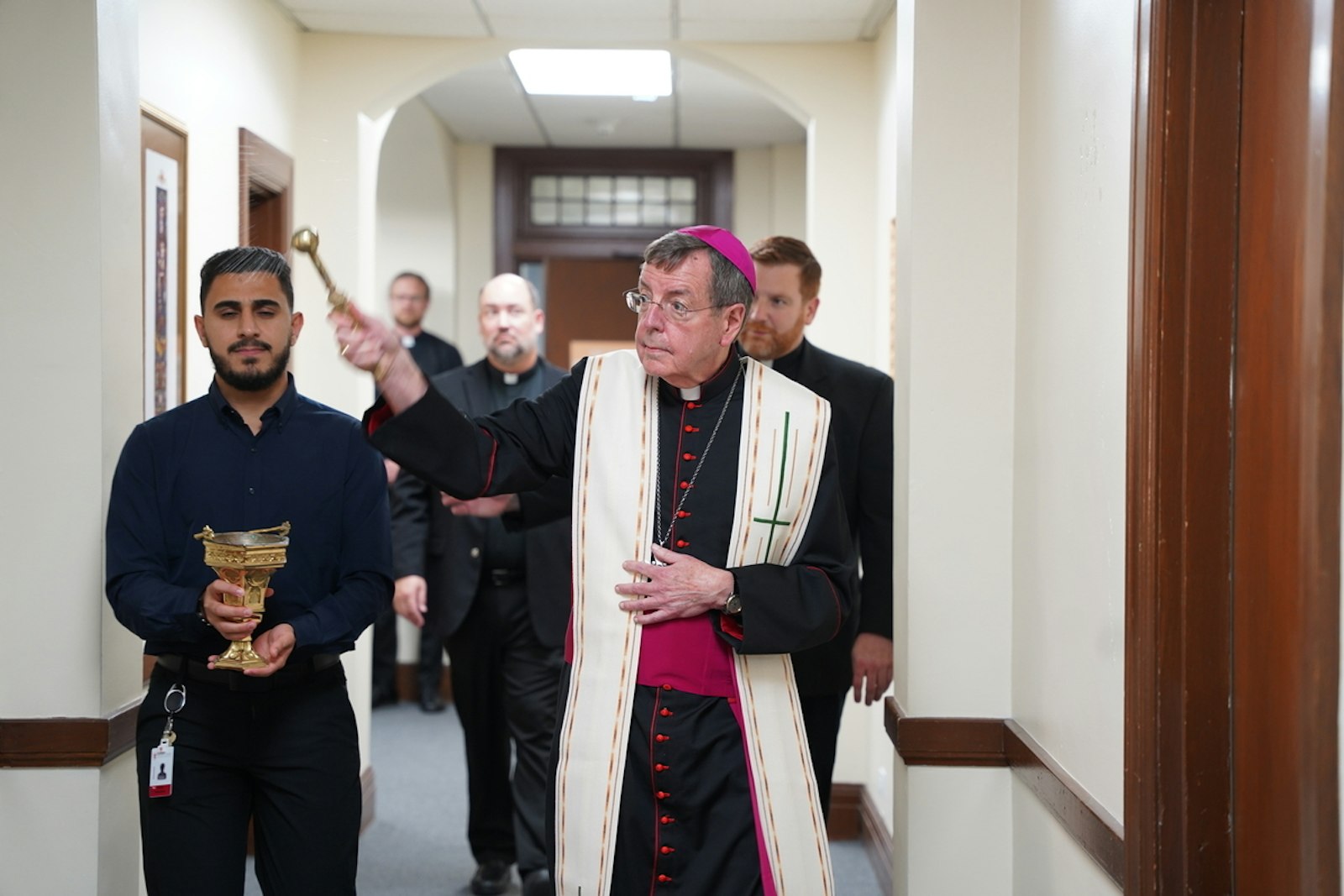 Archbishop Vigneron blesses dorm rooms and common areas in a repurposed wing of Sacred Heart Major Seminary reserved for first-year seminarians Sept. 19.