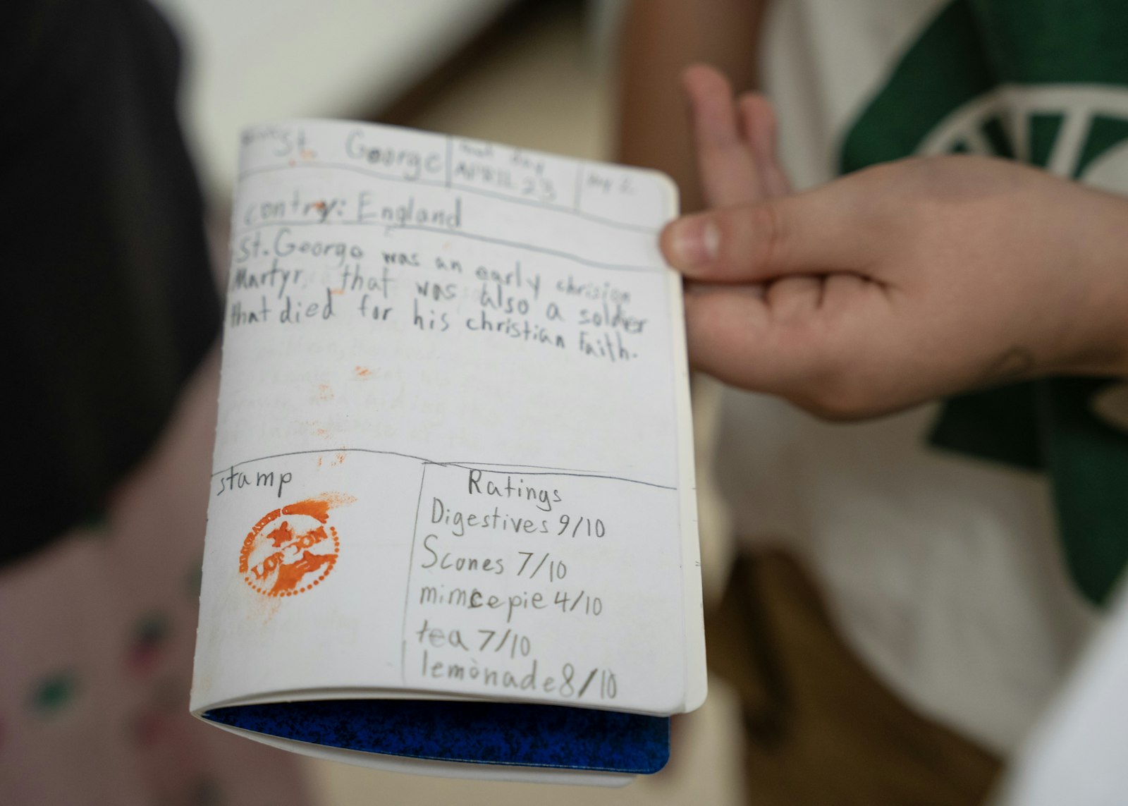 In their passports, the students have a chance to be food critics, rating items on a number scale with a simple “ugh” or “yummy!”