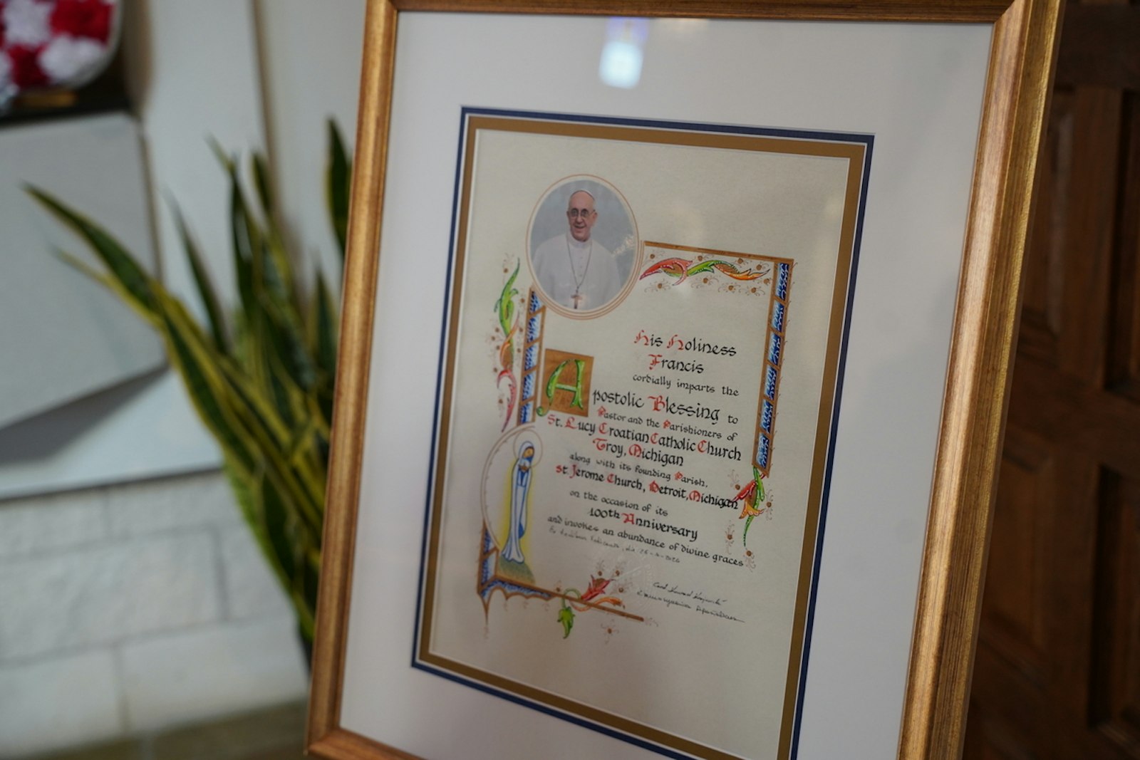 A blessing from Pope Francis given to St. Lucy Parish as a gift was presented to the parish by Archbishop Vigneron.