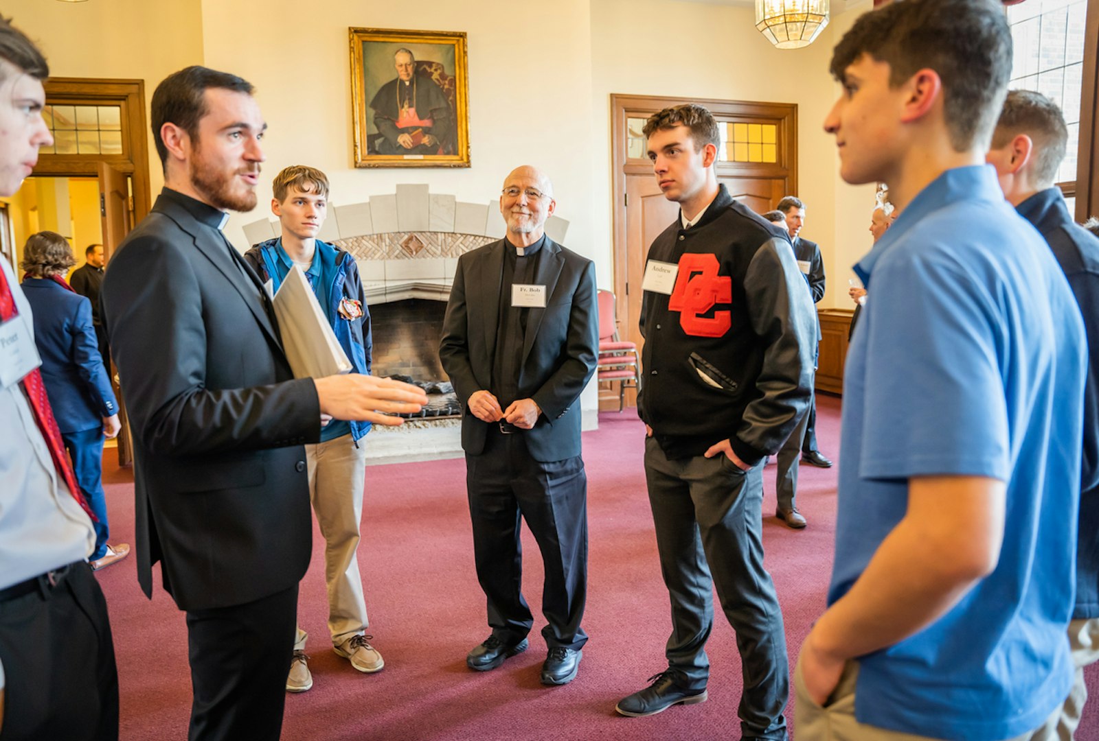 Priests from Divine Child Parish in Dearborn speak with young men visiting Sacred Heart Major Seminary in March 2023. (Valaurian Waller | Detroit Catholic)