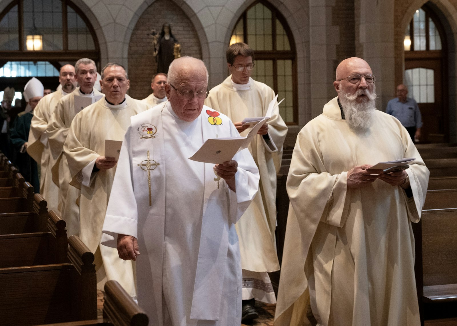 Jubilarian priests process into the chapel at Sacred Heart Major Seminary on June 18 for a special Mass with Archbishop Allen H. Vigneron honoring priests celebrating 25, 30, 40, 50, 60 and 70 years of priesthood. Priests celebrating milestones over 60 years also took part in the celebration.