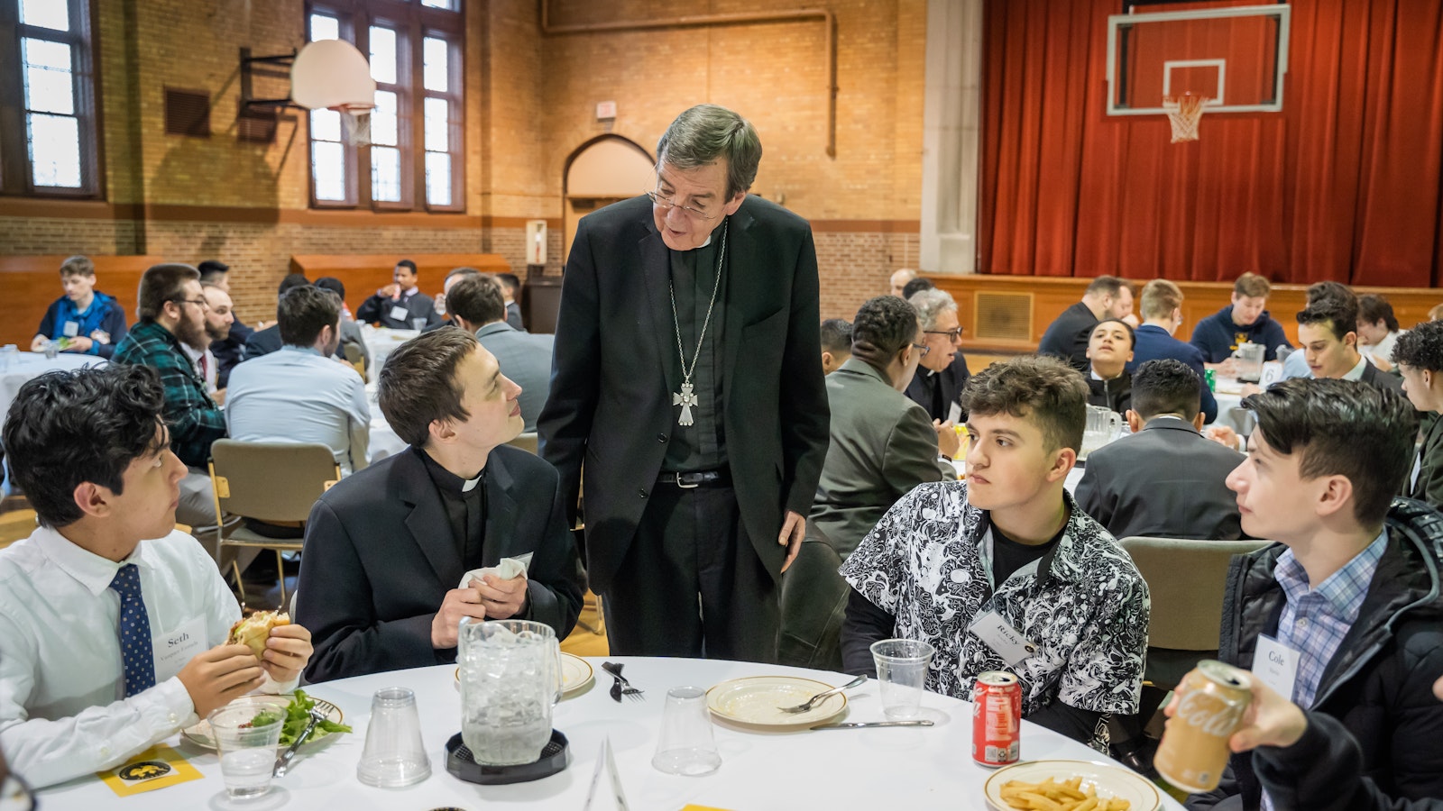 Archbishop Vigneron chats with Fr. Kevin Roelant and young men visiting Sacred Heart Major Seminary for a vocational discernment evening March 28, 2023. (Valaurian Waller | Detroit Catholic)