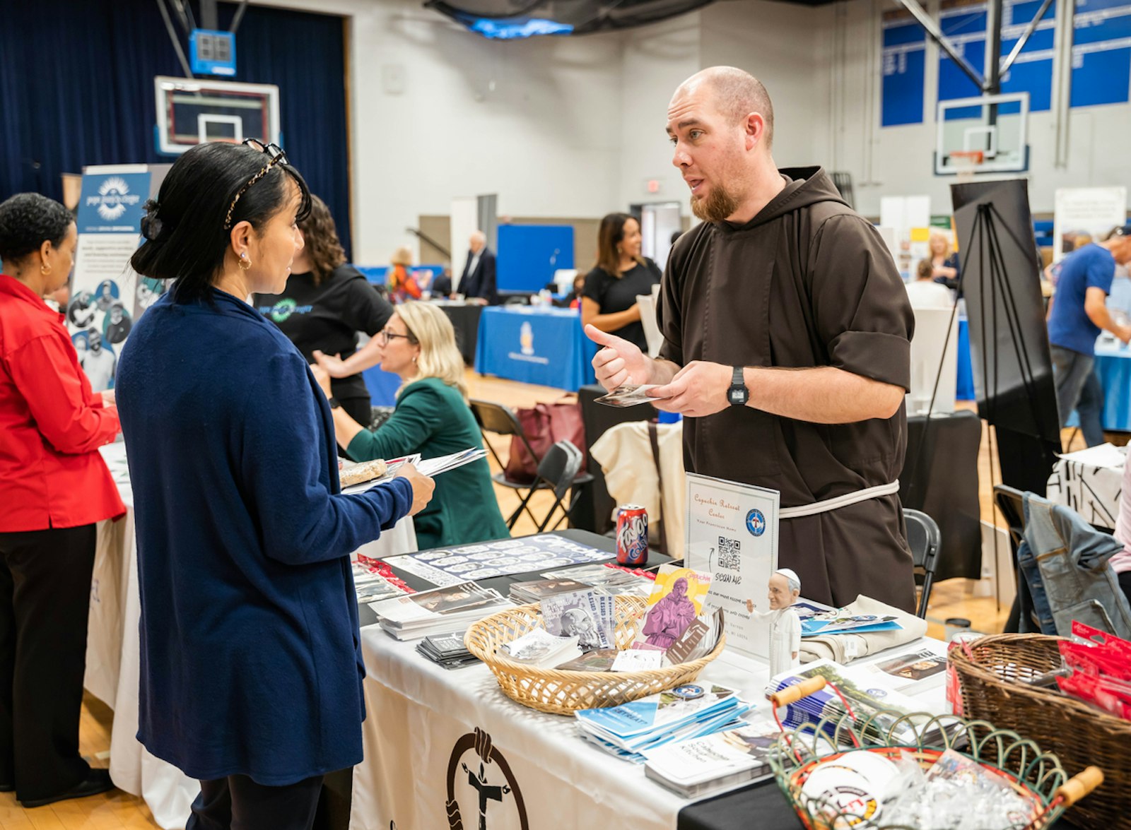 Bro. Igor de Bliquey, OFM Cap., explains some of the work of the Capuchin Franciscan Province of St. Joseph to interested participants during the 2022 Mission Partners Expo at Madonna University in Livonia.