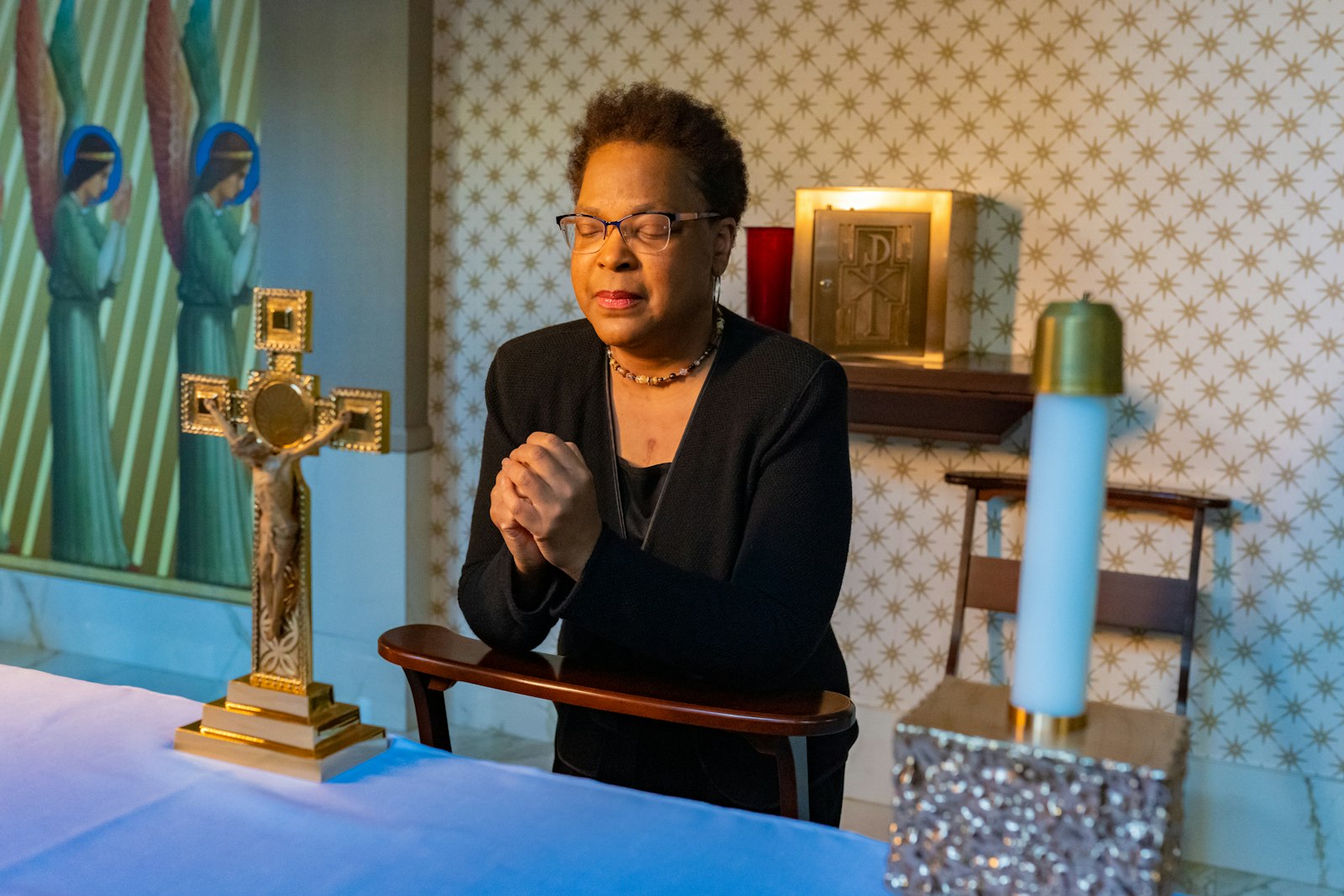 Figueroa prays in the chapel of the Archdiocese of Detroit's Chancery building in downtown Detroit. On July 23, 2021, Figueroa was informed she had a heart, and had to shut down her life for six months with two hours' notice. Figueroa straightened up her home, packed a bag and called her ride to take her to the hospital. She went into surgery, Saturday, July 24. The next thing she remembers, it was Wednesday, July 28.