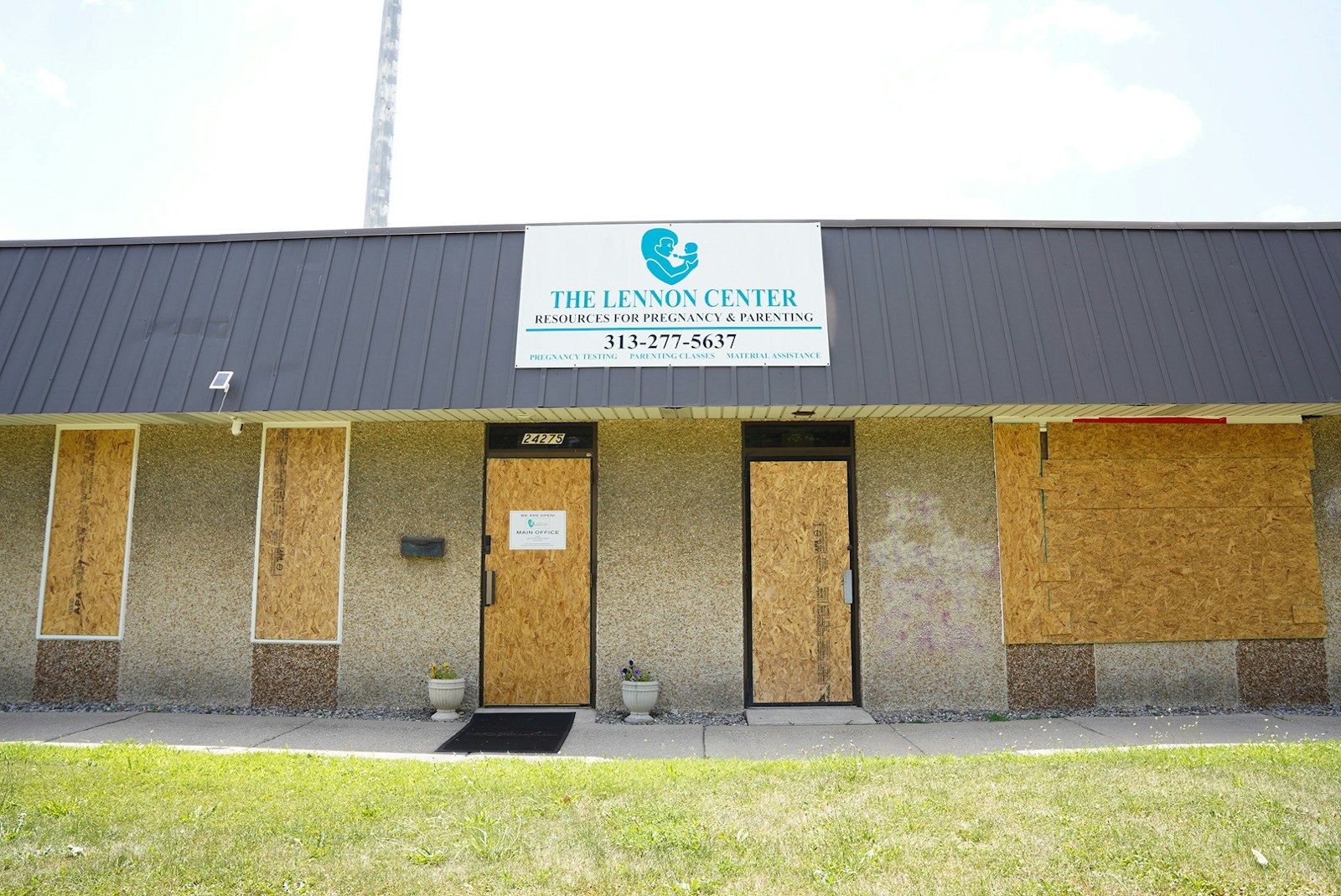 The windows and doors of the Lennon Pregnancy Center in Dearborn Heights have been boarded up since the June 20 attack, during which vandals left a message reading, "If abortion isn't safe, neither are you."