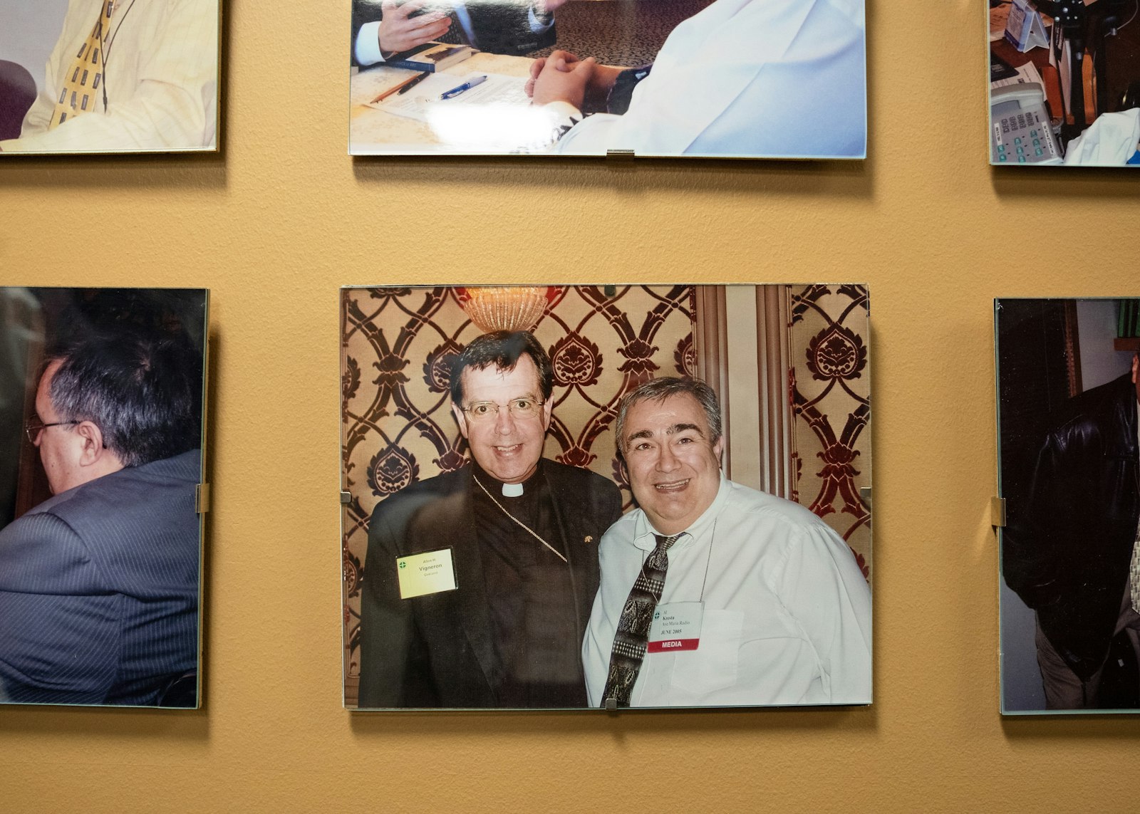 A photo on the wall of the Ave Maria Radio studios shows late host and station president Al Kresta with Detroit Archbishop Allen H. Vigneron, who was a frequent guest on Kresta's program.