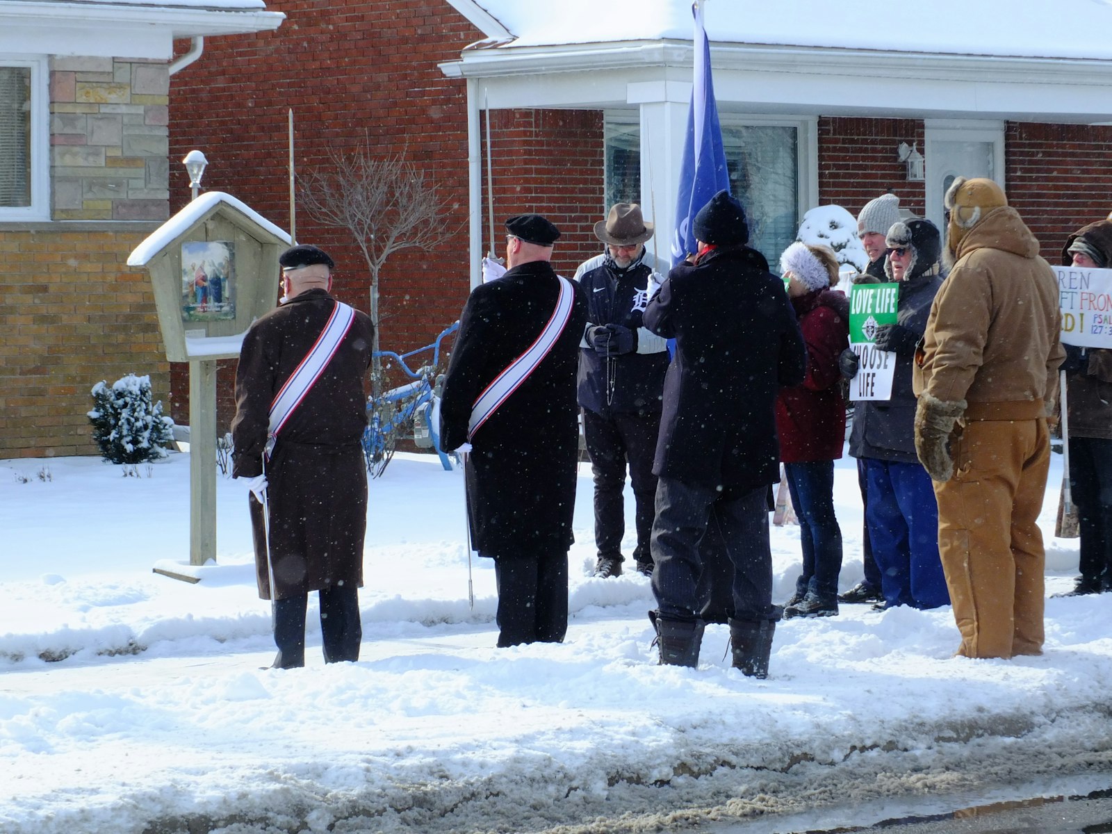 Fourth-degree Knights of Columbus stop to lead marchers in the rosary during the annual Downriver March for Life on Jan. 23.