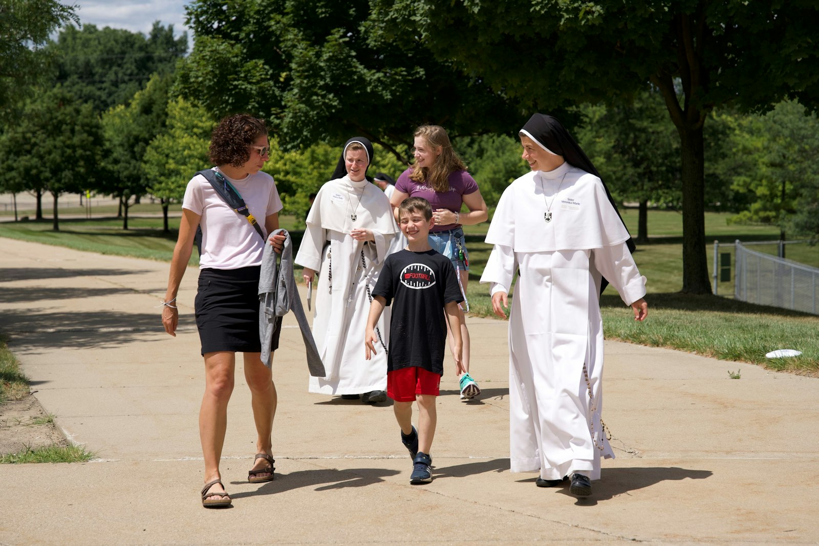 The Dominican Sisters of Mary, Mother of the Eucharist accompany family members and friends on the way to the 25th anniversary celebration at Eastern Michigan University.