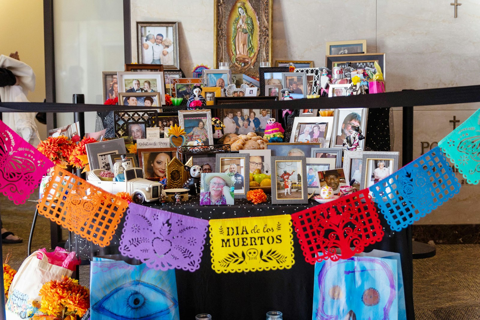 “The ‘ofrenda’ has three layers to it, to remind us the Church has three levels: The church that is still here, the militant; the church in purgatory, the penitent; and the church victorious, who made it to heaven,” said Veronica North, outreach manager to the Hispanic community for Catholic Funeral and Cemetery Services.