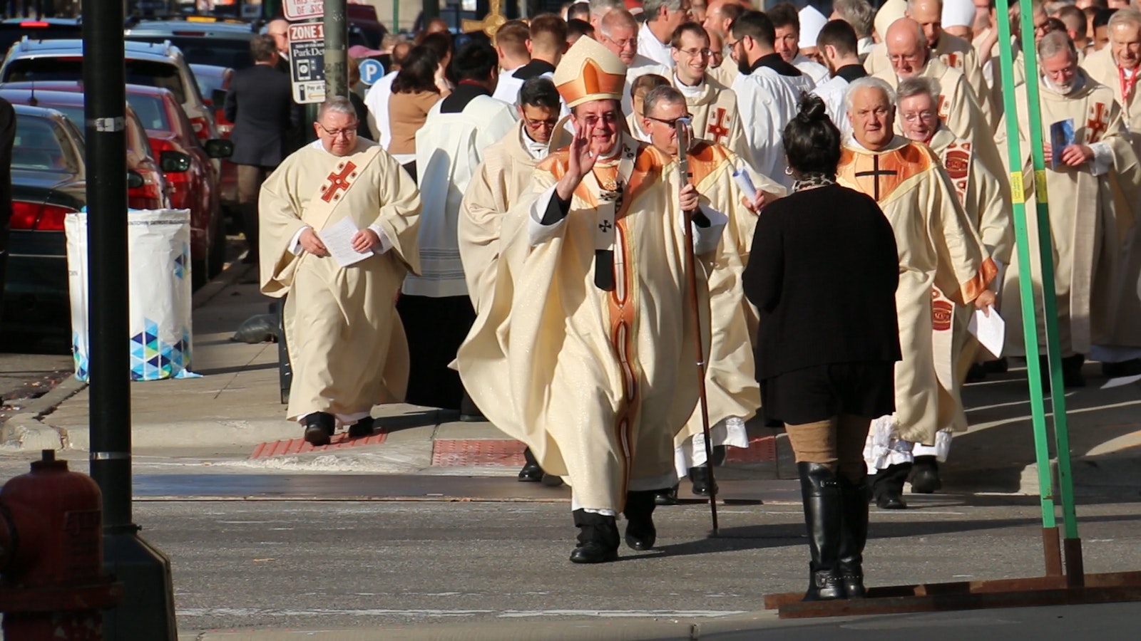 Archbishop Vigneron leads a joyful procession from St. Aloysius Parish in downtown Detroit to the Westin Book Cadillac hotel for the opening of Synod 16 on Nov. 18, 2016. The Holy Spirit's movement during the three-day gathering has been the genesis and driving force of the Archdiocese of Detroit's missionary transformation, the archbishop says.