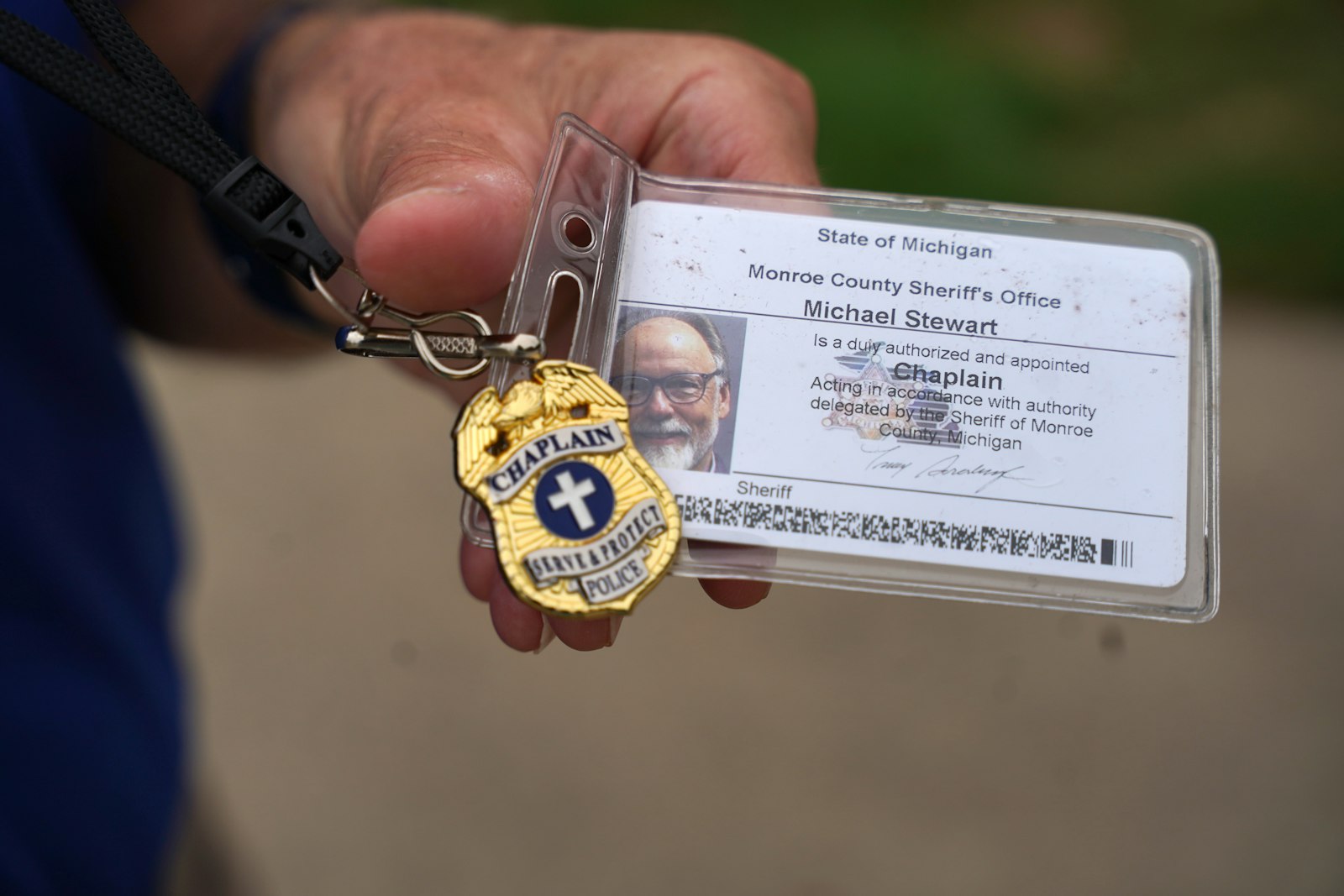 Deacon Stewart has his own badge and polo shirt he wears when doing chaplaincy work, often going on ride-alongs in squad cars or chatting with police officers during roll call.