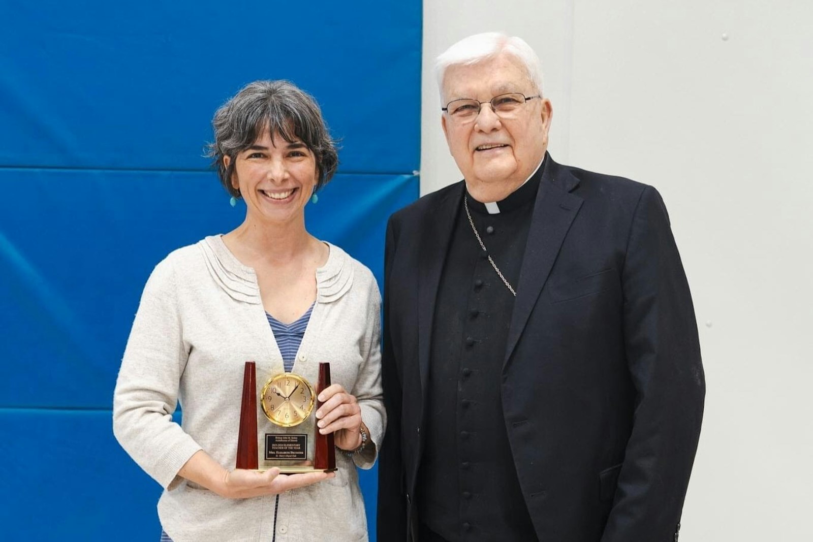 Bishop John M. Quinn presents this year's Bishop John M. Quinn Elementary School Teacher of the Year Award to Beth Decoster, a longtime English teacher at St. Mary School in Royal Oak. (Naomi Vrazo | Special to Detroit Catholic)