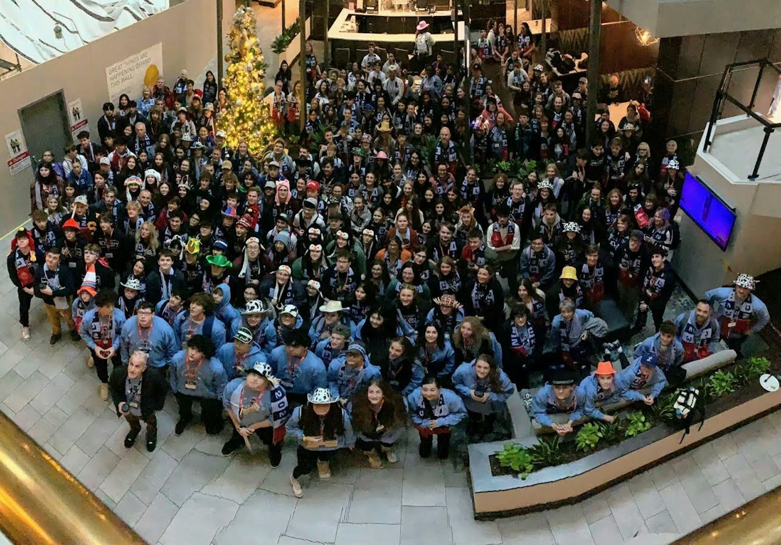 The Detroit delegation to the National Catholic Youth Conference in Indianapolis poses for a group photo. The Archdiocese of Detroit sent six buses of young people and chaperones to the conference, which was attended by more than 12,000 youths from all over the country. (Photo courtesy of Laura Piccone-Hanchon)