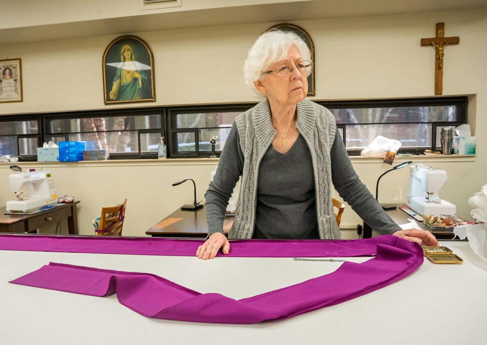 Sewer Dorothy Merlo prepares a vestment in the Eucharistic Mission Band's meeting room at St. Bonaventure Monastery on Detroit's lower-east side. For a $150 donation, the group can complete a chasuble and a stole for priests in the Capuchin mission fields overseas.