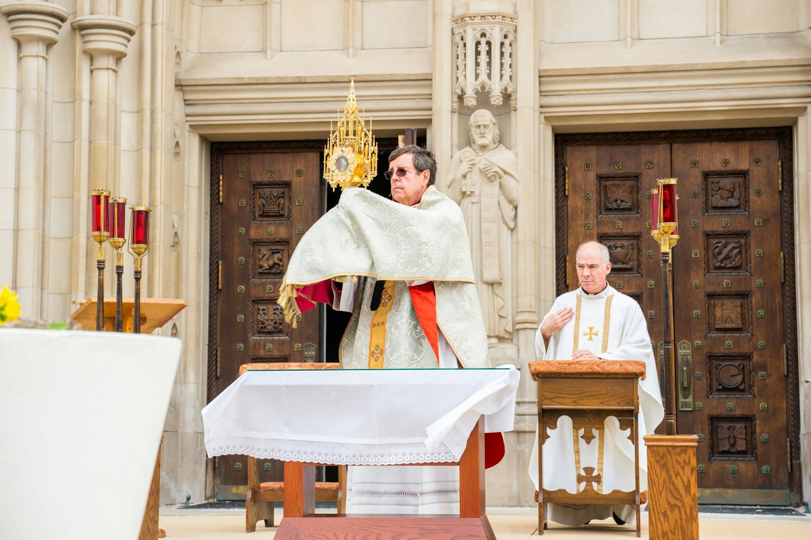 On Easter Sunday, April 12, 2020, Archbishop Allen H. Vigneron stands on the steps of the Cathedral of the Blessed Sacrament in Detroit, raising high the monstrance with the Body of Christ, and invoking a blessing on the people of the Archdiocese of Detroit. (Valaurian Waller | Detroit Catholic)