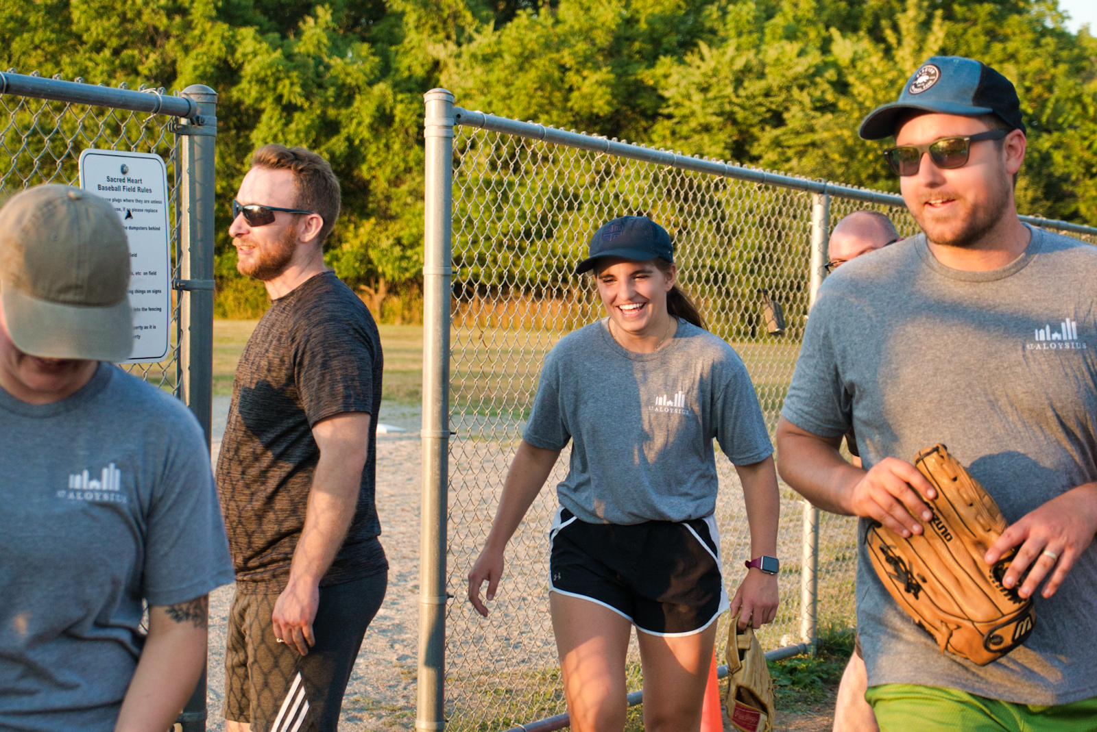 Players from the "Resurget Cineribus" team from St. Aloysius Parish in downtown Detroit smile and laugh. The atmosphere of friendly camaraderie promotes a healthy teamwork mentality both within and between the two Families of Parishes, organizers said.