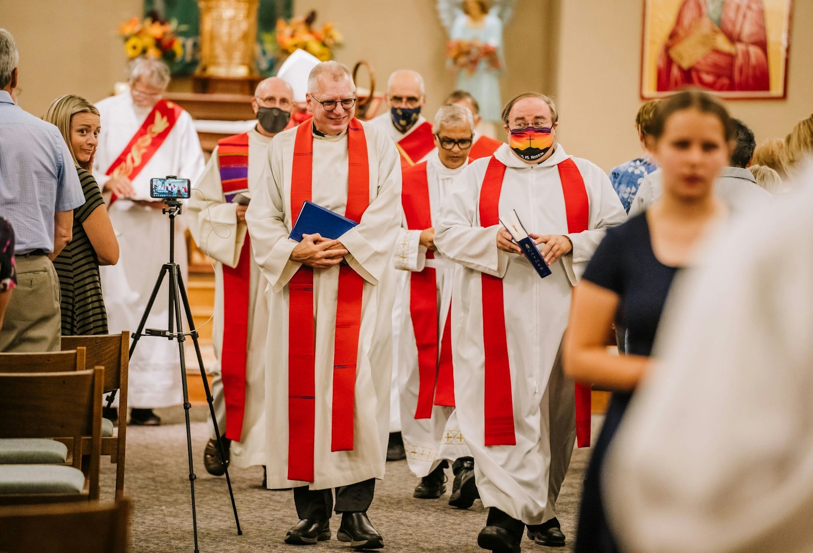 The priests of the Downriver 3 Family of Parishes process out of St. Timothy Parish in Trenton during a Sept. 14, 2021, commissioning Mass. Fr. Marc Gawronski, left, was named moderator of the six-parish family, but each of the priests shares responsibility for the pastoral care of the faithful in each parish. (Valaurian Waller | Detroit Catholic)