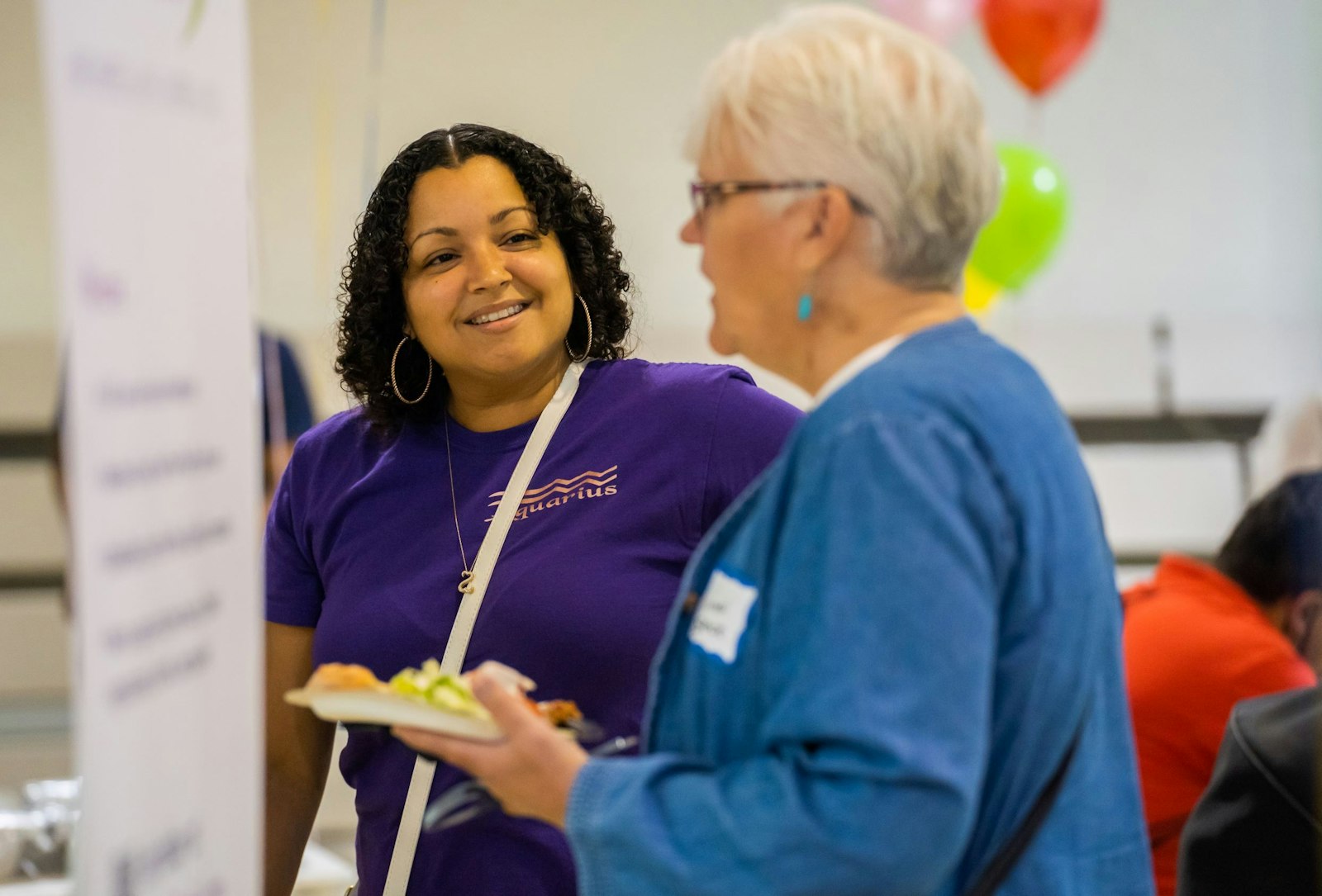 Parishioners talk with one another during a Family of Parishes gathering at St. Scholastica Parish in Detroit on July 16, 2021. The event brought together parishioners and clergy from the newly formed Trinity Family 1 — comprising St. Juan Diego, St. Scholastica, St. Mary of Redford, Corpus Christi, Presentation/Our Lady of Victory and SS. Peter and Paul (Westside) parishes. (Valaurian Waller | Detroit Catholic)