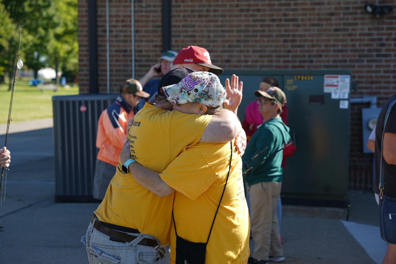 Shannon McCalley of Fraser (right) greets a friend at the fishing derby. McCalley remembers going fishing with her grandpa and looks forward to the annual event as an opportunity to meet up with friends for a day of fishing.