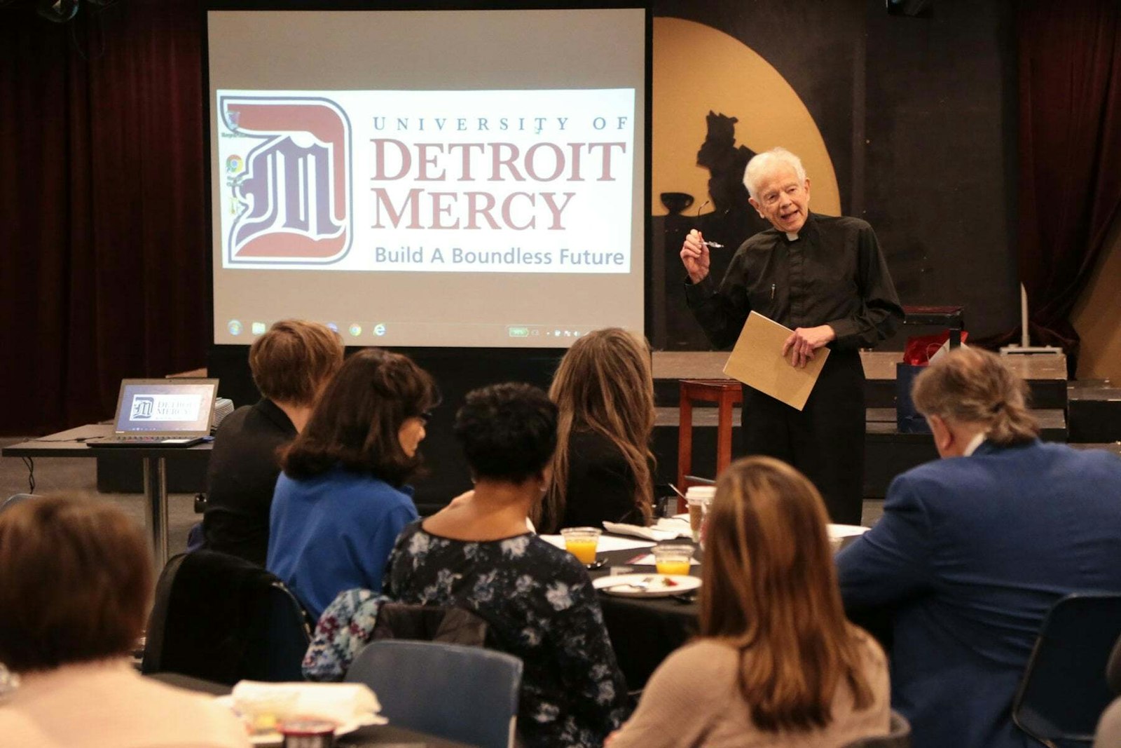 Fr. Gerald Cavanagh, SJ, gives a lecture at the University of Detroit Mercy in this file photo. His contributions to the field of business ethics include a focus on corporate social responsibility, a concept that was almost unheard of when Fr. Cavanagh started in the field more than 50 years ago. (Courtesy of the University of Detroit Mercy)