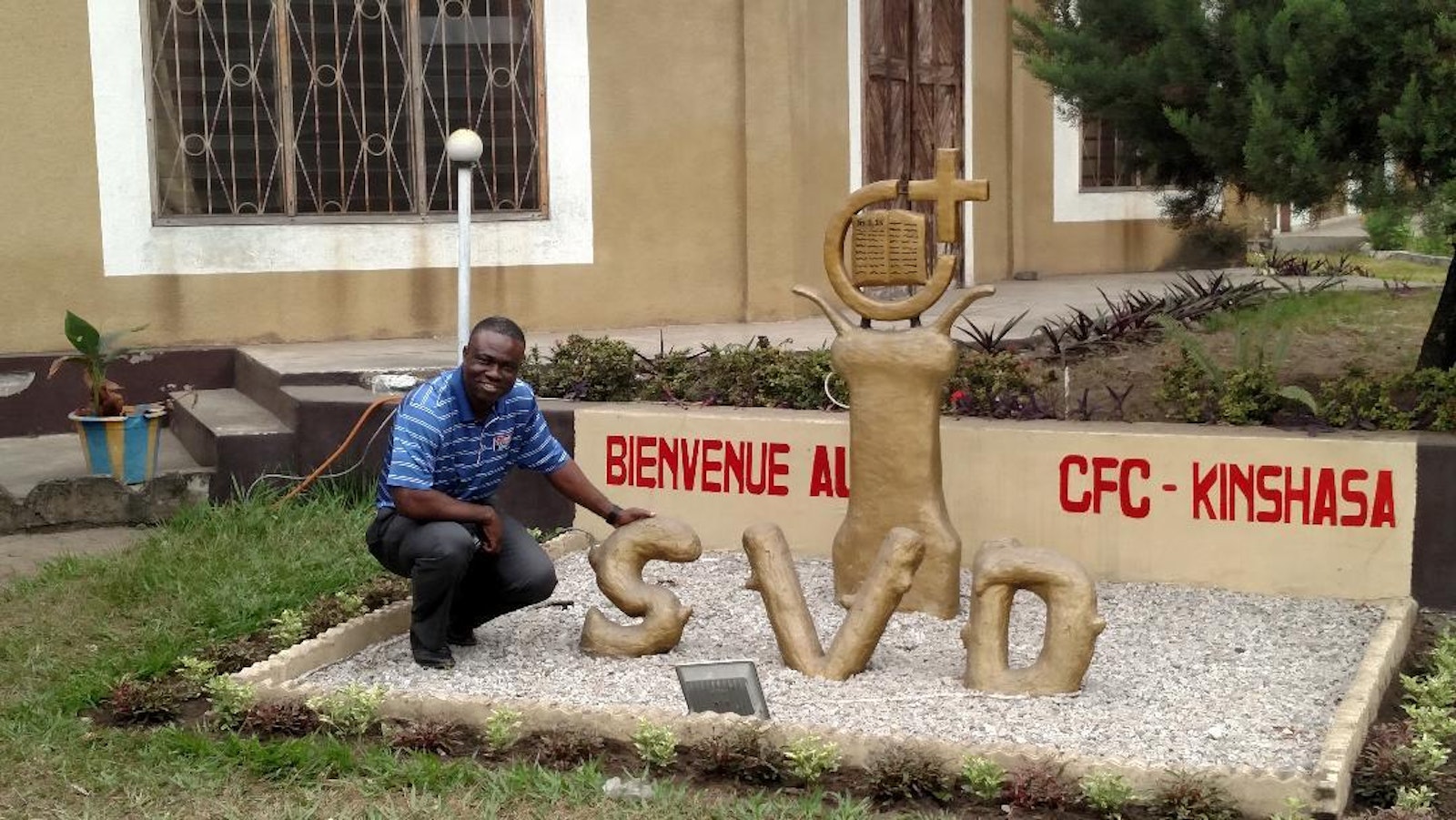 Fr. Jean Ikanga poses for a photo outside the complex where he lives with his religious community, the Society of the Divine Word, in the central African nation of the Congo.